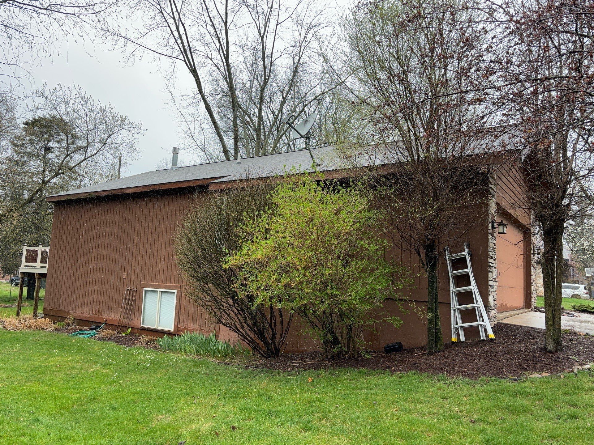 Installing new Roof and Gutter Protection after Hail Damage by Acme Exteriors