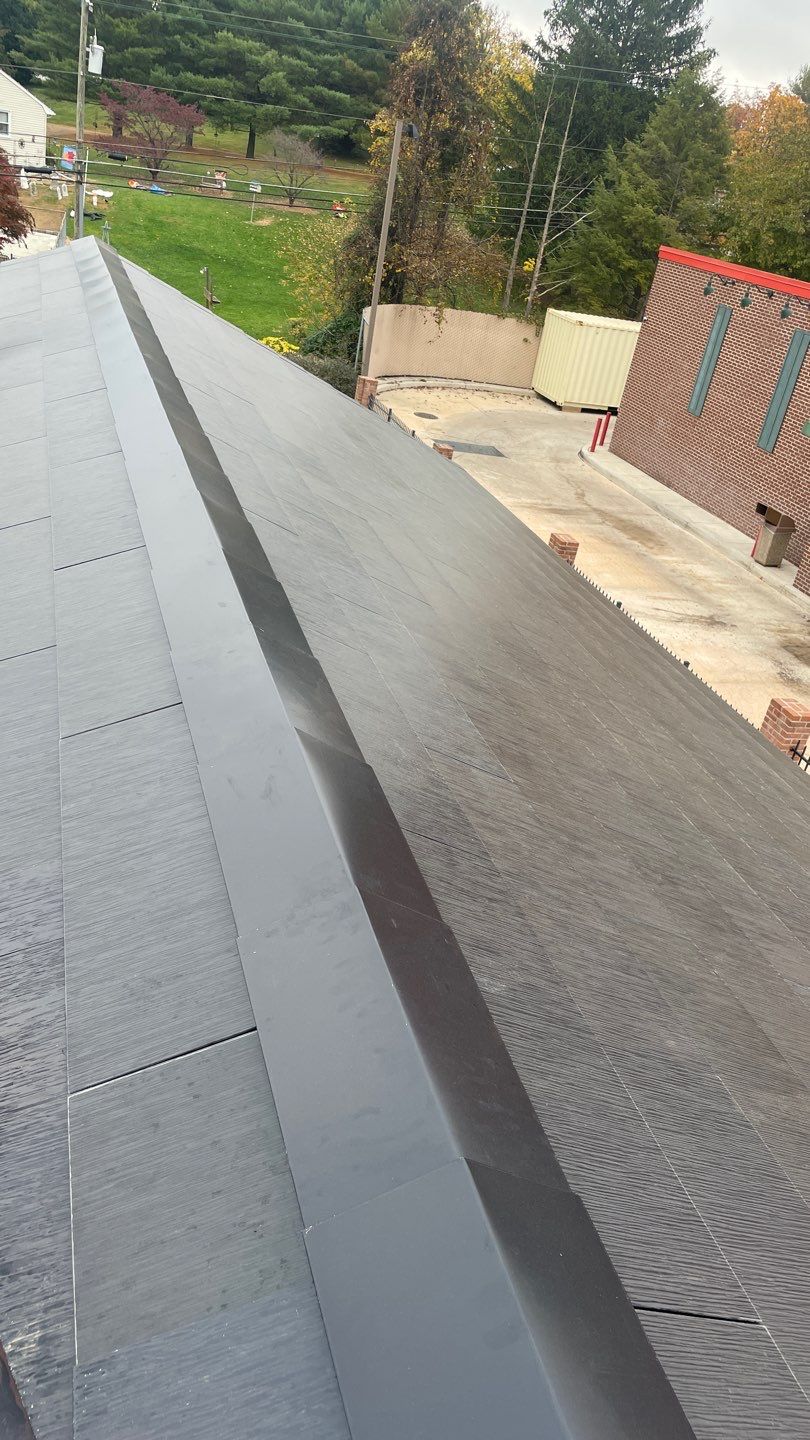 Tesla Solar Roof on a Commercial Building by American Home Contractors