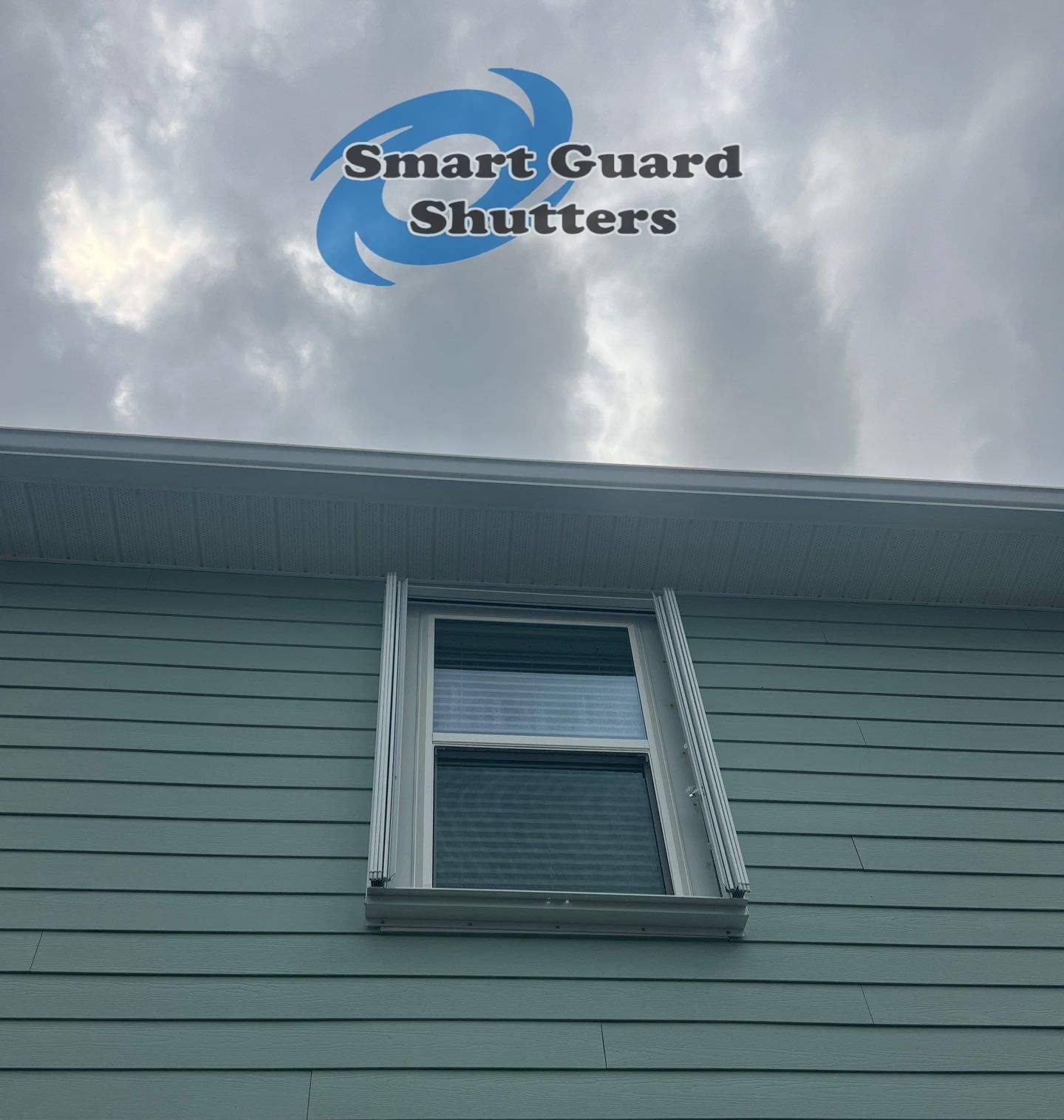 Impact Bahamas in Ocean Blue, Accordion in White by Smart Guard Shutters