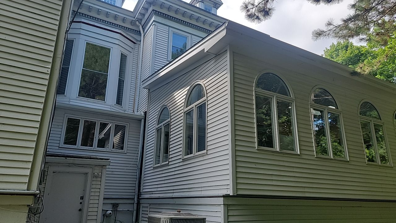 Housewashing  using Algaecide, soft wash soap by Northern Power Washing LLC.