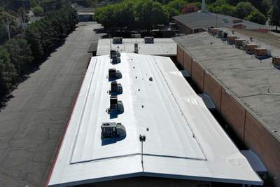 MR Roofing system using Benchmark/PUMA XL coatings over TPO single-ply roofing