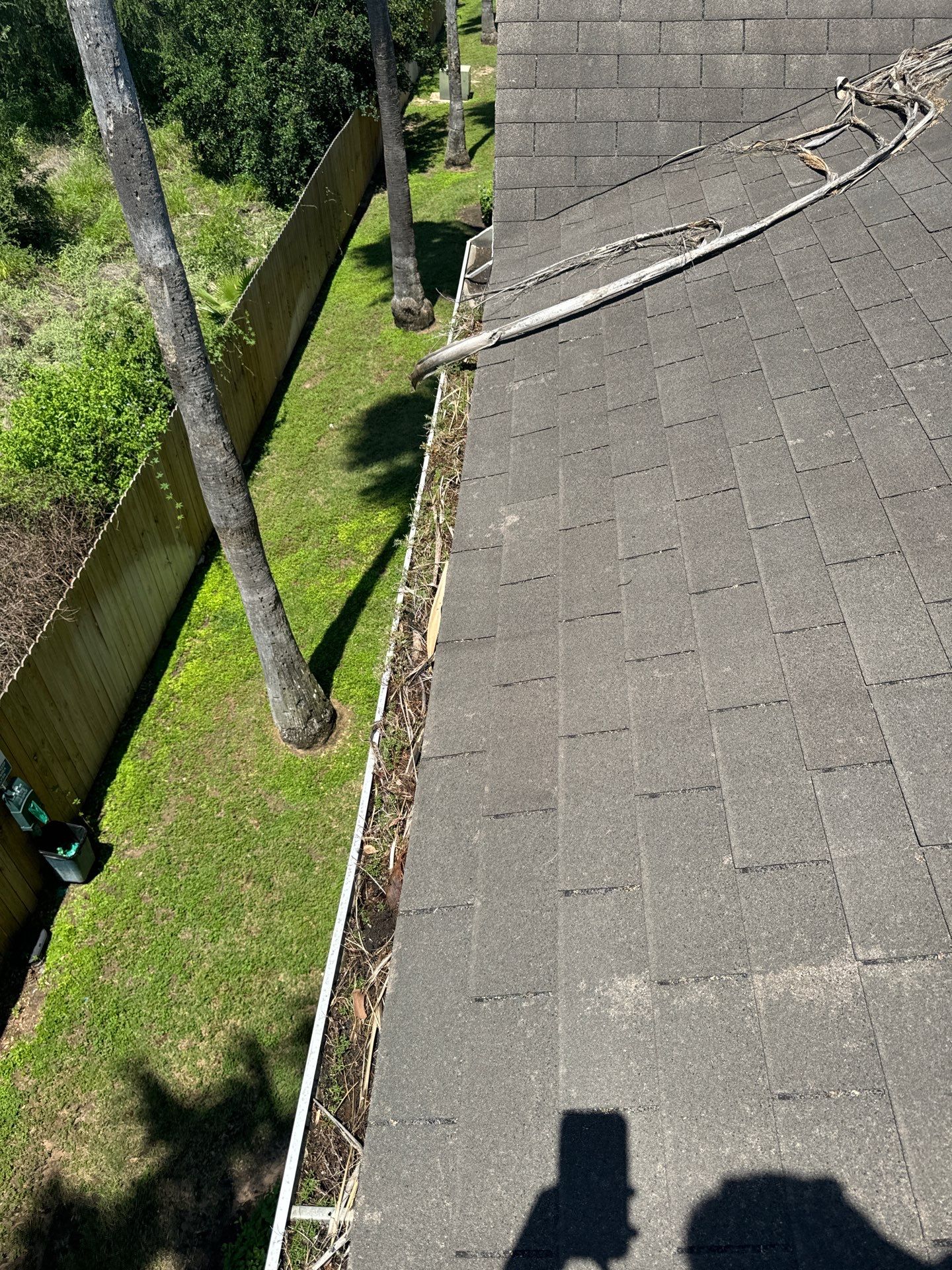 Commercial gutter cleaning Corpus Christi, TX before photo with filled gutters