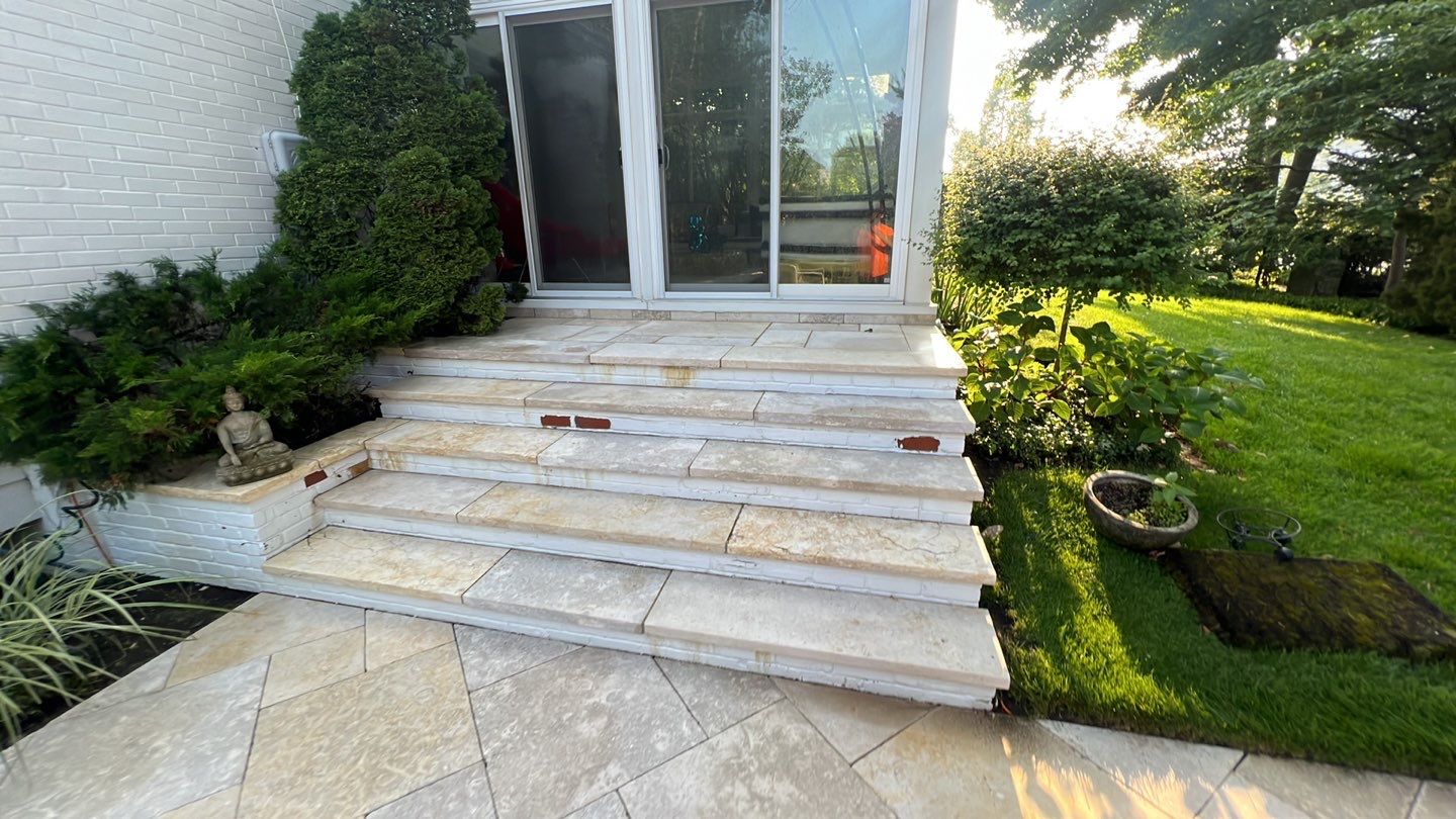 marble patio cleaning and sanding using Polysweep polymeric sand by Northern Power Washing LLC.
