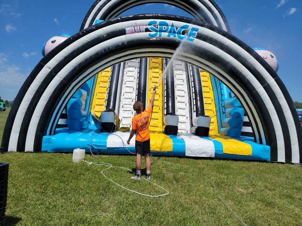 Cleaning for big bounce america prior to a large event by Northern Power Washing LLC.
