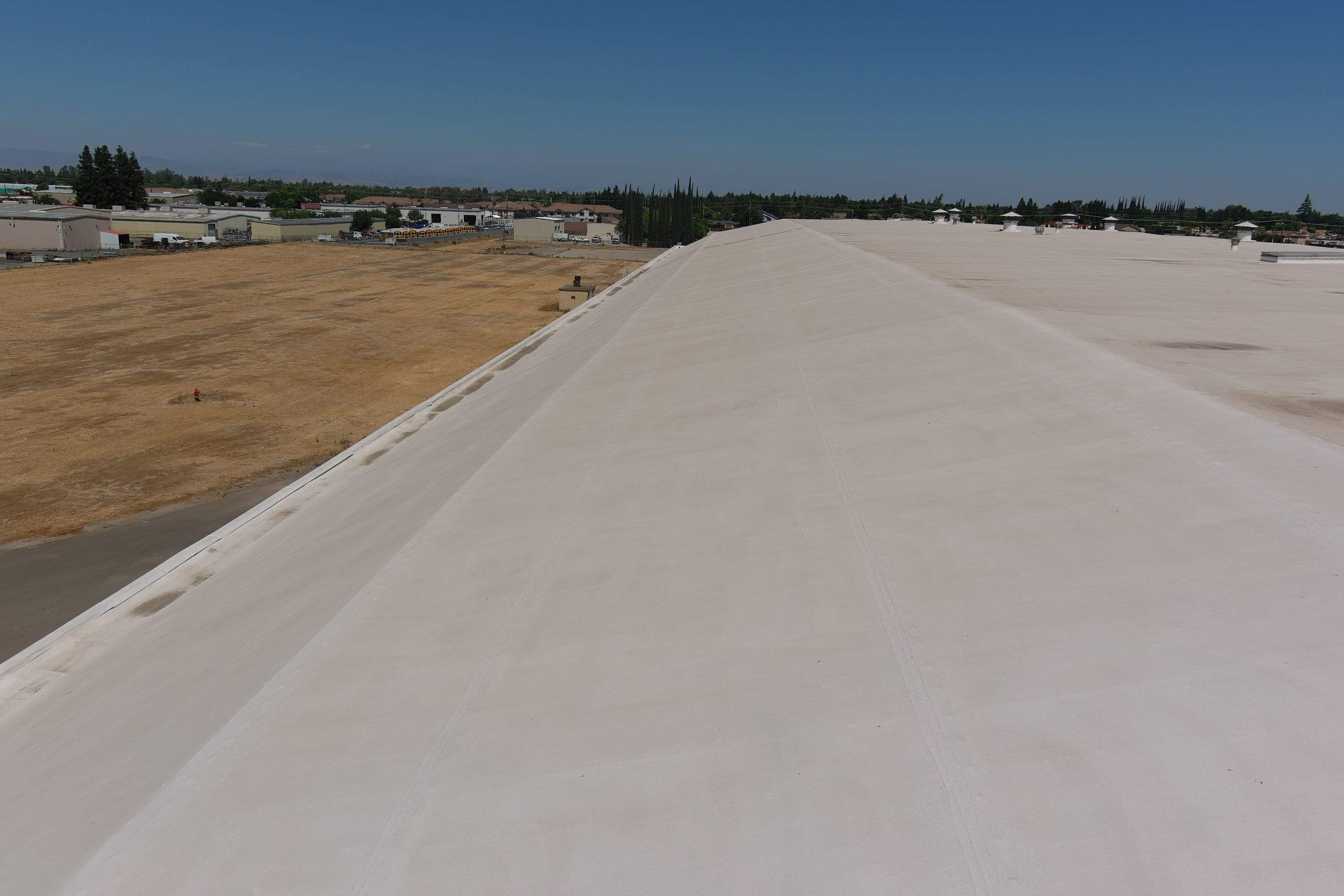 Single-ply restoration system using Conklin Benchmark/PUMA XL fabric and coating by Straight Edge Roofing Inc
