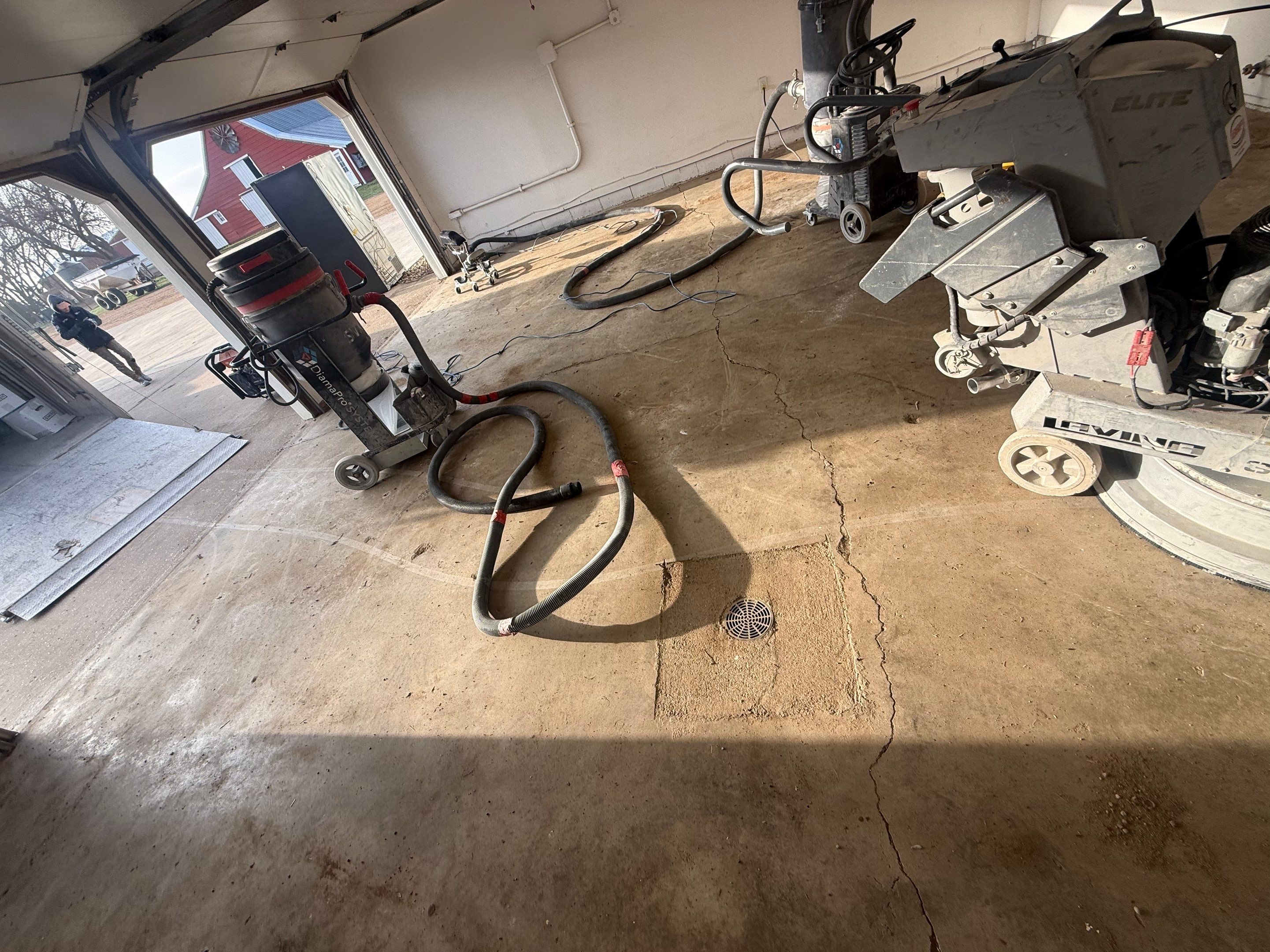 Feather Grey Garage Floor Coating and Crack Repair in Beresford by Select Painting, Coatings & Garage Cabinets