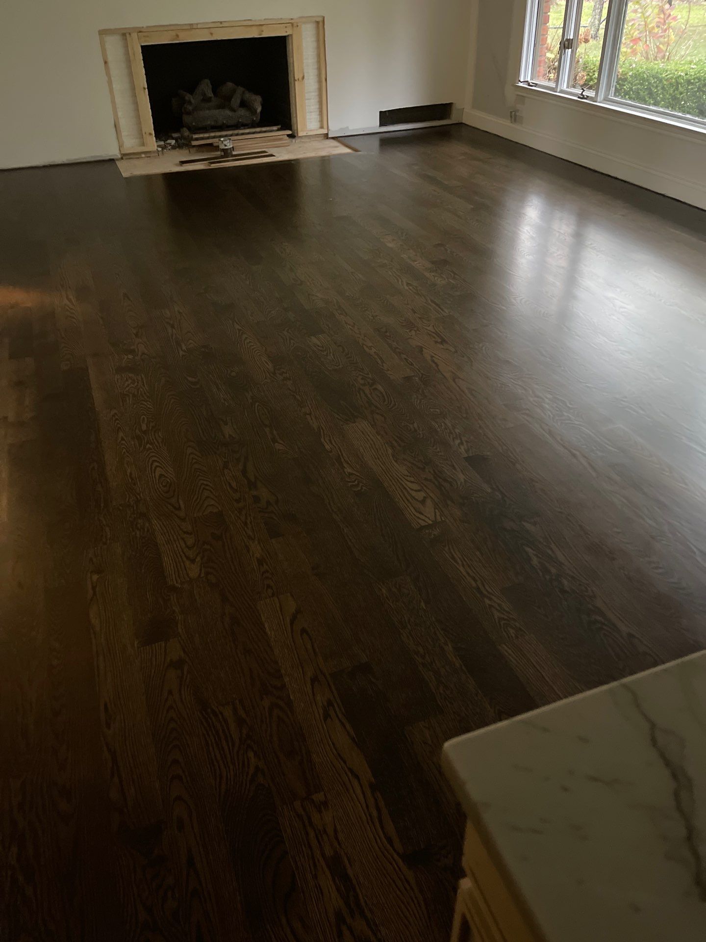 New Flooring installation using 4" White oak select grade plain sawn Ebony Stain by Ann Arbor Hardwoods