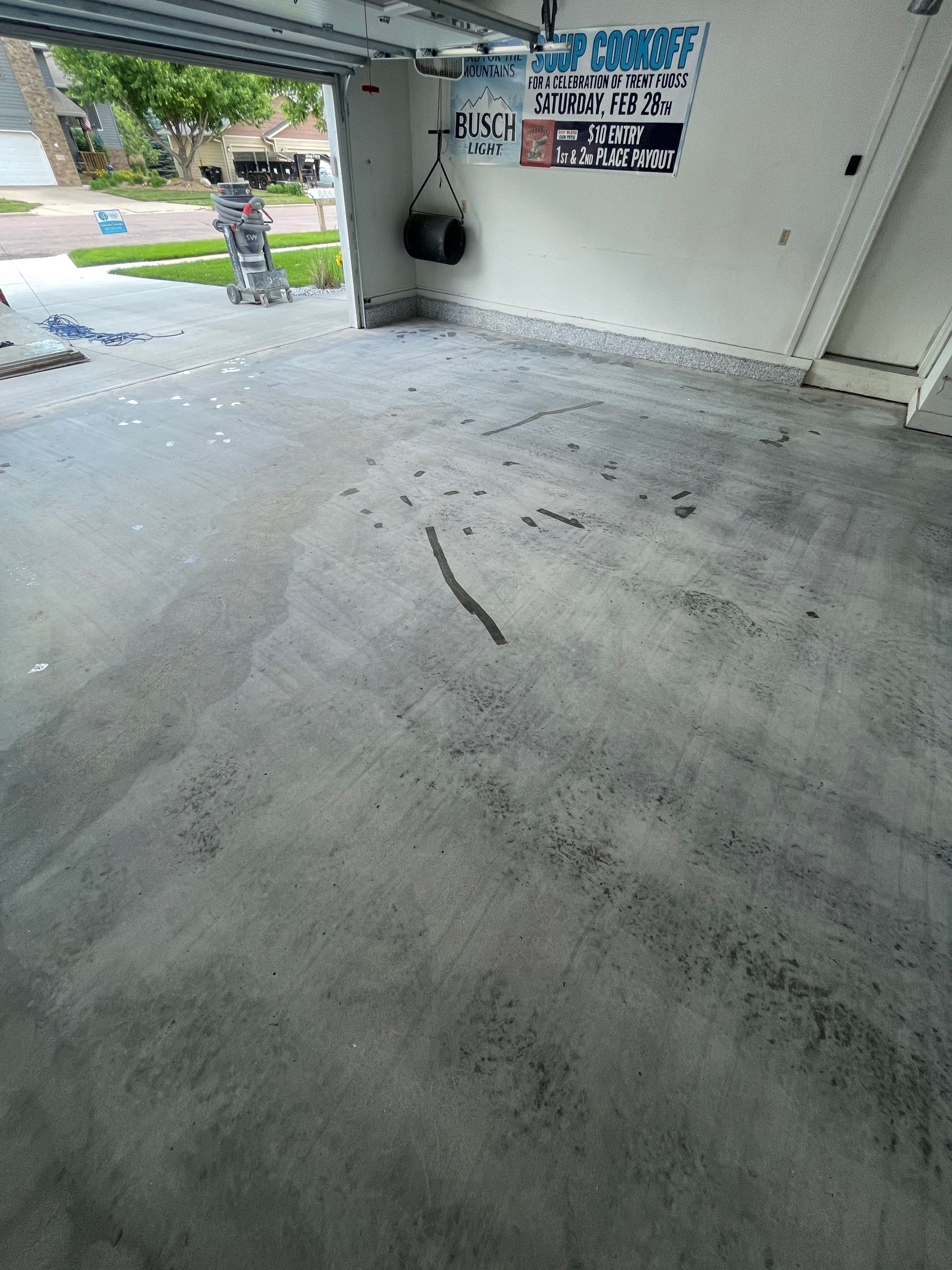 Residential Garage Floor Coating with Feather Grey Finish in Sioux Falls by Select Painting, Coatings & Garage Cabinets