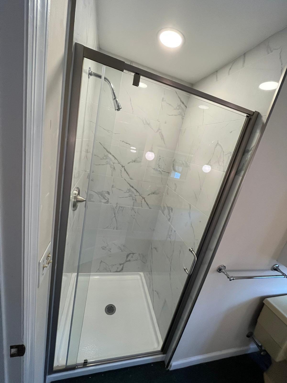 Bathroom Remodel using Tile by Home Concepts Construction