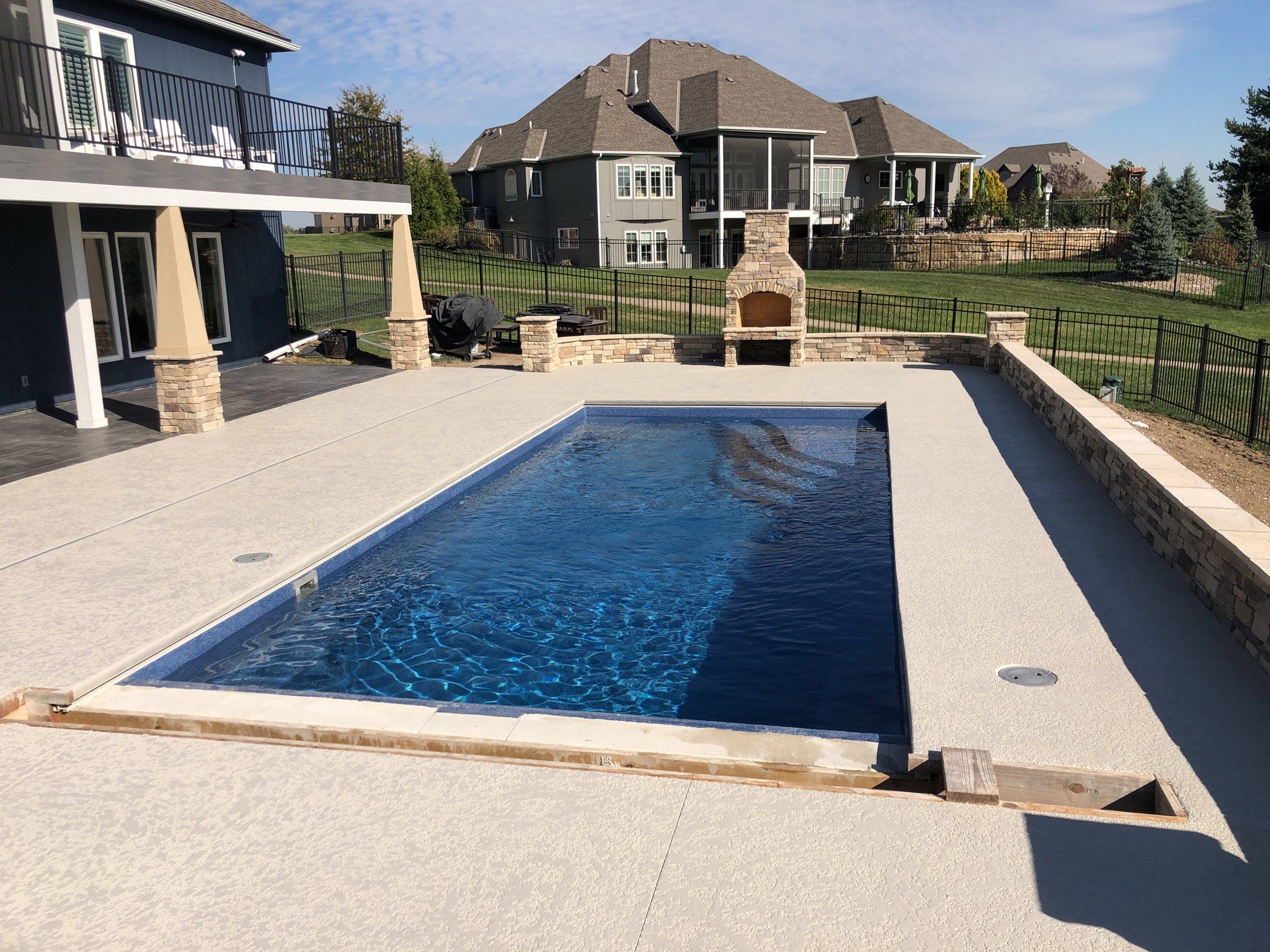 Parkville, MO -- Pool Deck Coating with Classic Texture (knockdown) finish by Big Red Decorative Concrete, LLC