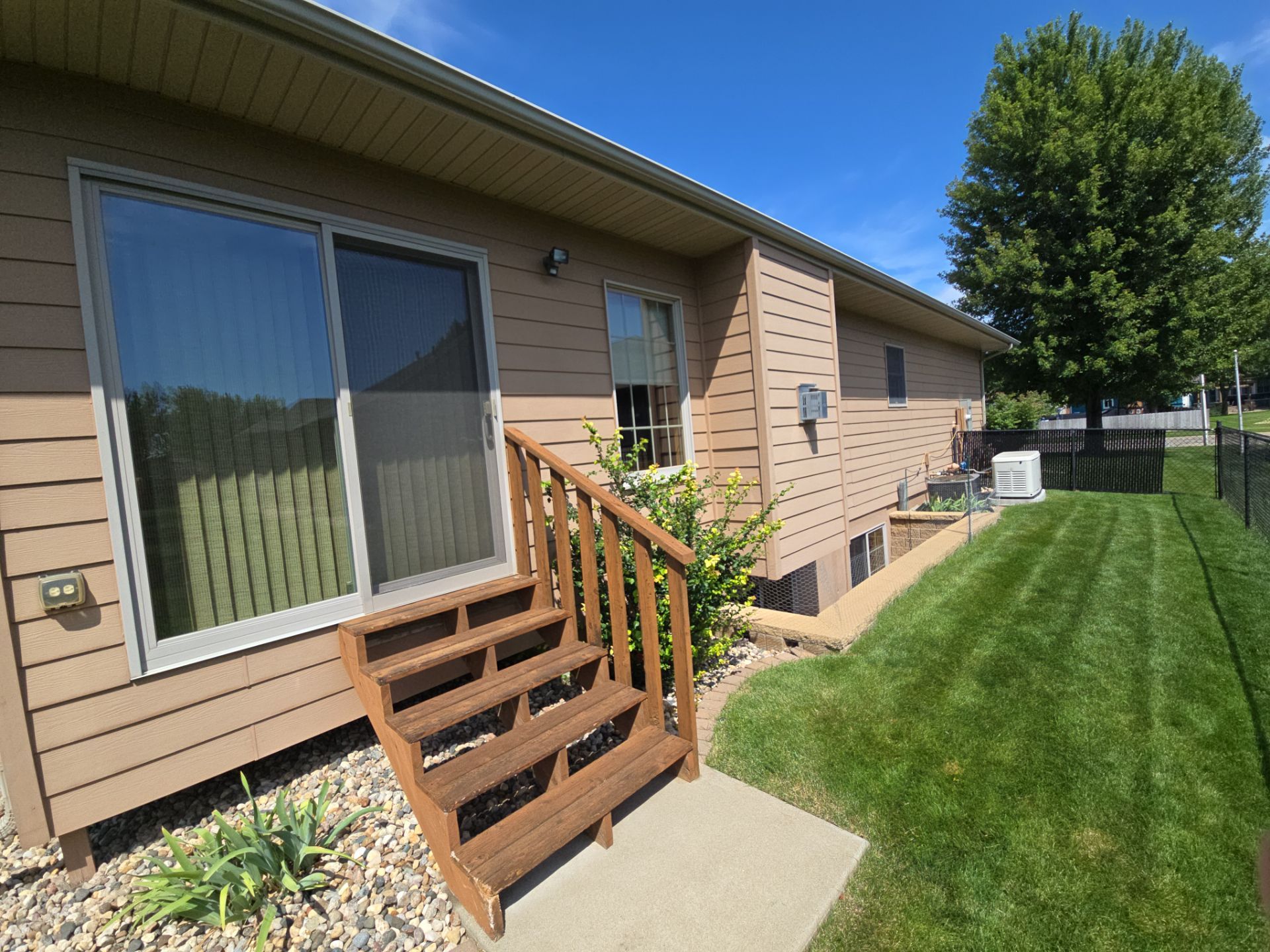 Sioux Falls Residential Exterior Door and Siding Refresh by Select Painting, Coatings & Garage Cabinets