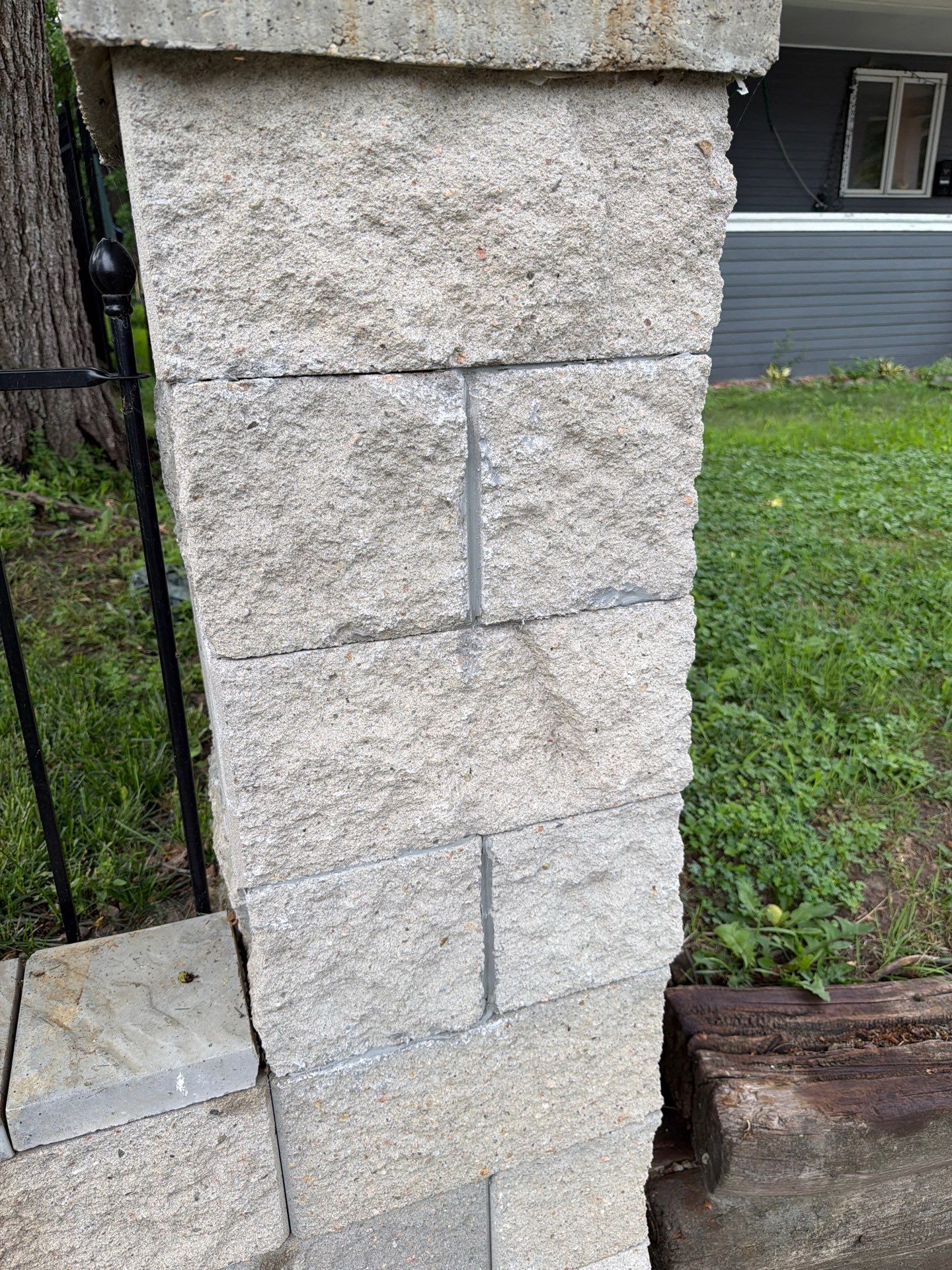 Exterior Masonry Painting for a Sioux Falls Retaining Wall by Select Painting, Coatings & Garage Cabinets