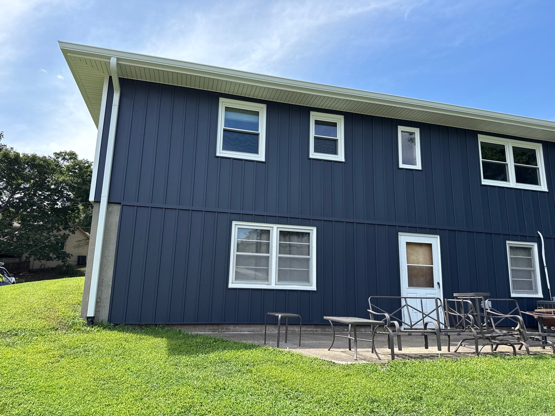 Indigo Board and Batten Siding and Window Replacement in Smithville by EEC Windows, Siding & Roofing