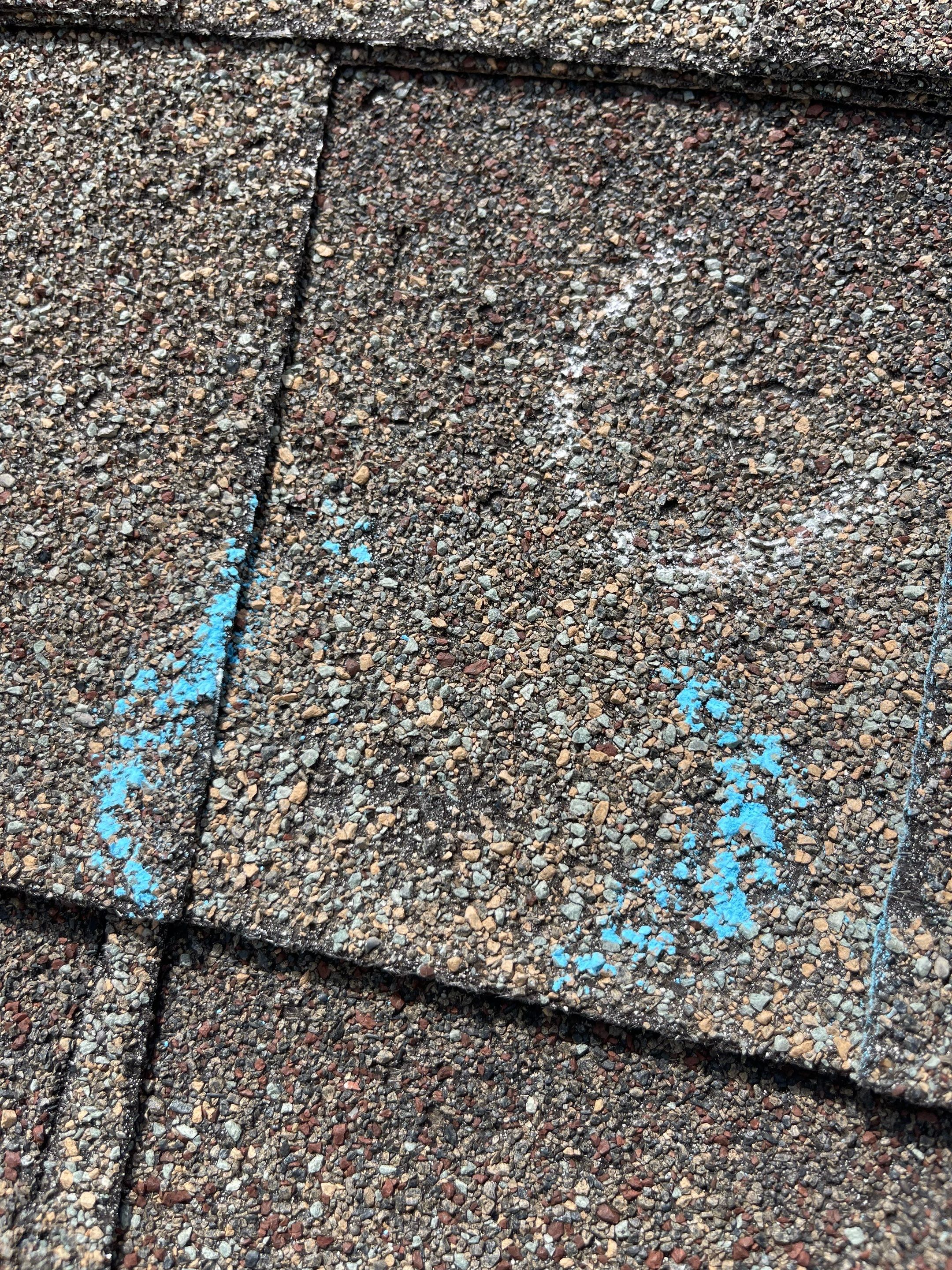 Hail Damage on a Roofing System by Icon Roofing And Construction 