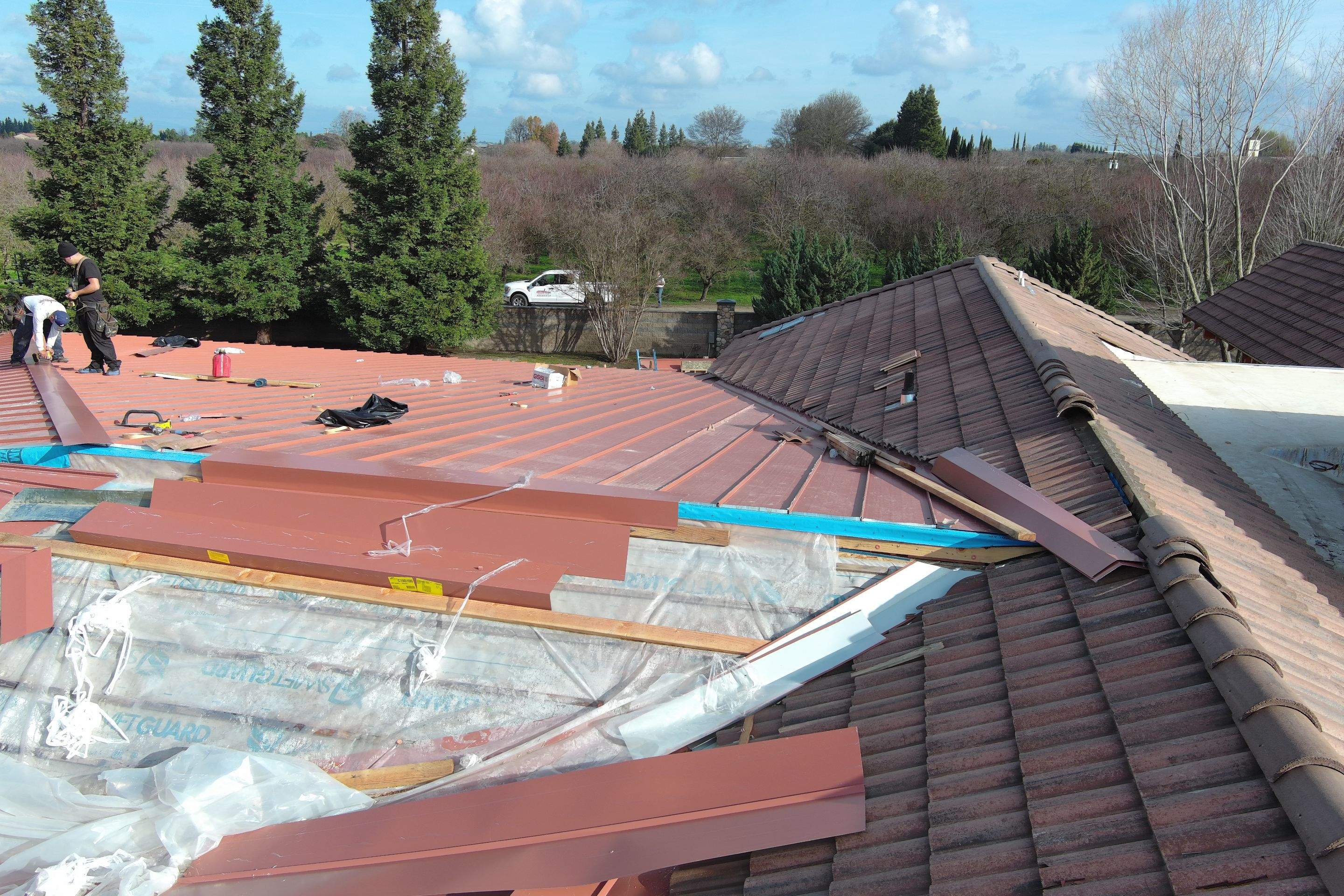 Tile, Metal, and TPO roofing project (new construction) by Straight Edge Roofing Inc