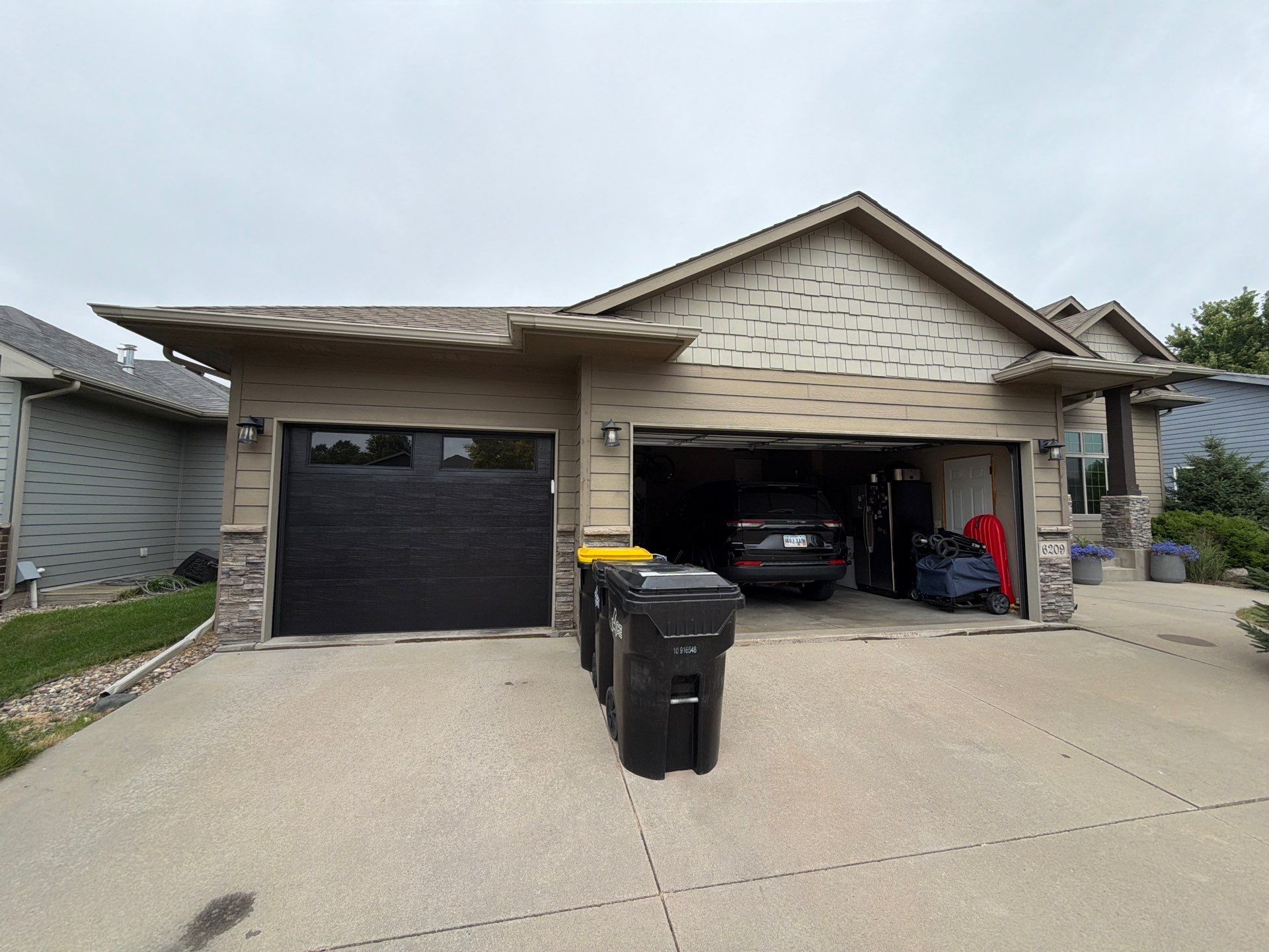 Full Exterior Siding Repaint for Sioux Falls Home and Garage by Select Painting, Coatings & Garage Cabinets