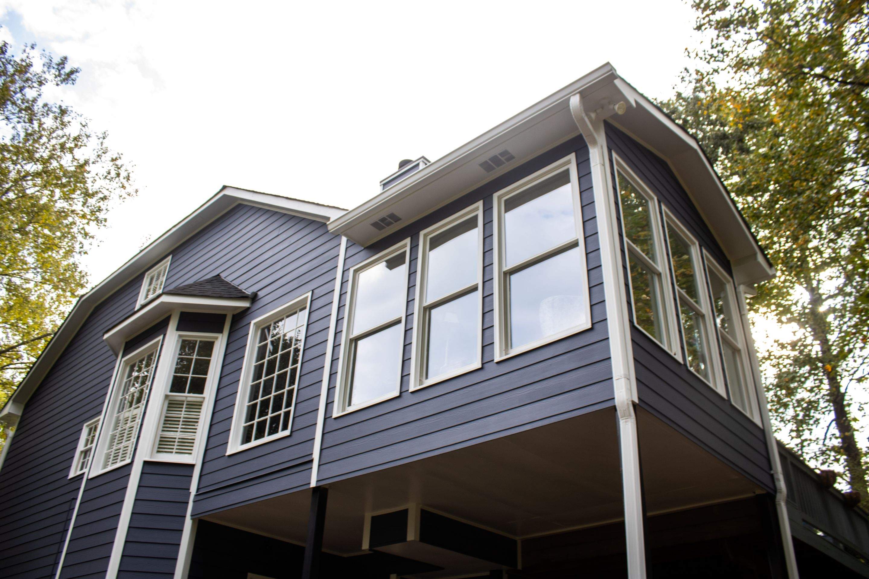 Blue Exterior Paint and Siding Installation using James Hardie Lap Siding by Nelson Exteriors