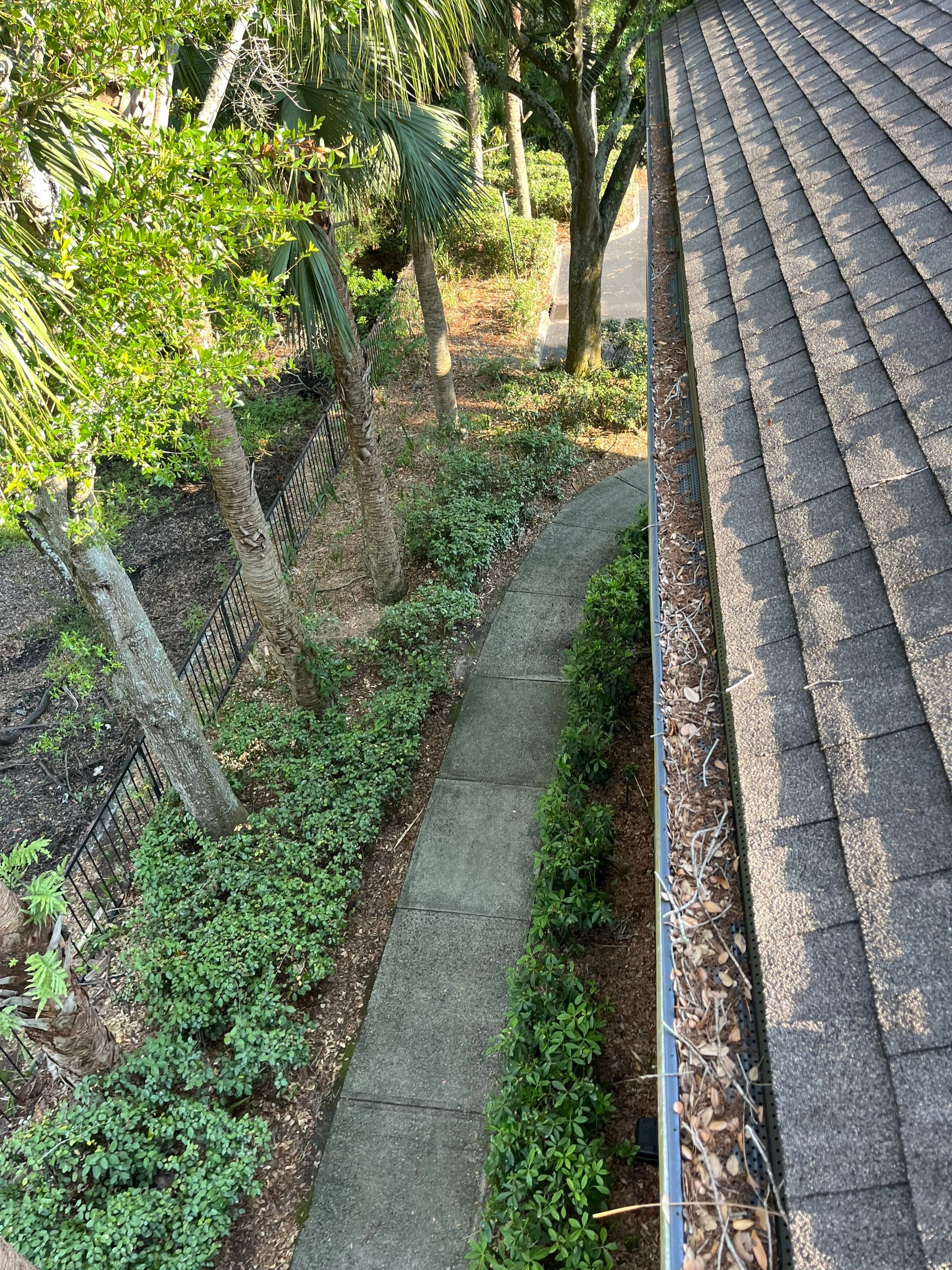 Commercial gutter cleaning Yulee, FL before photo with filled gutters