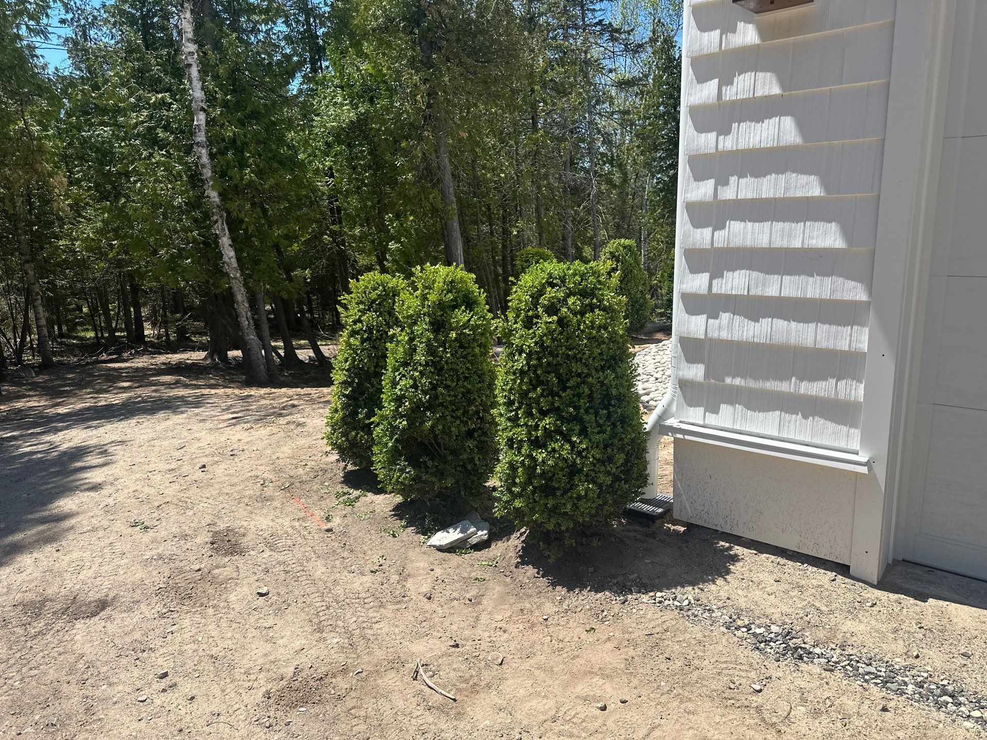 Gutter System and Exterior Drainage Installation in Charlevoix by Rainbow Seamless Systems