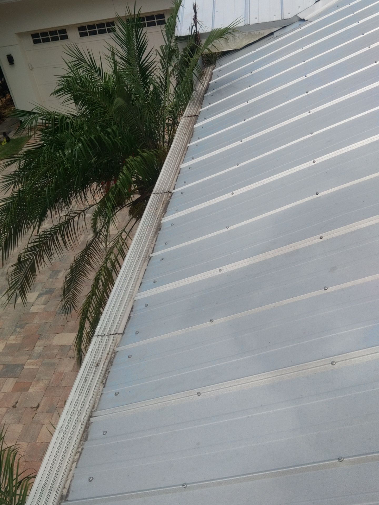 Gutter guards installation combined with gutter cleaning in Sarasota, FL by Gutter Professors