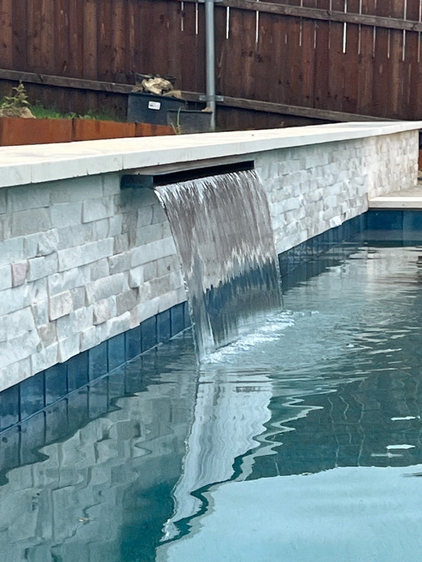 Geometric Pool with Raised Water Feature Wall by Pinnacle Pools and Spas - DFW