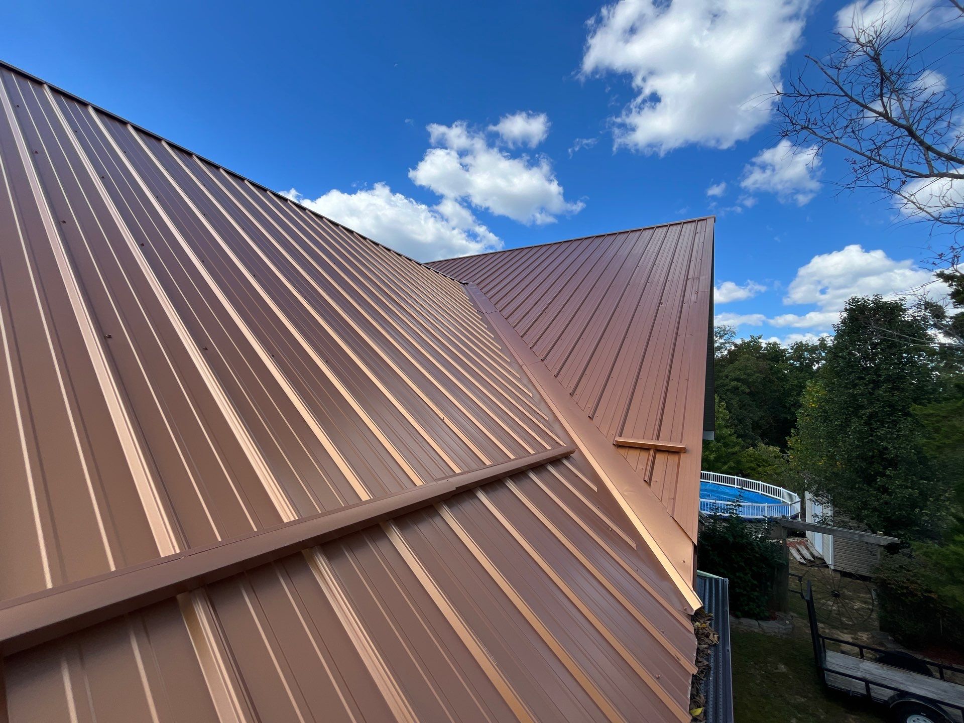 Residential Roofing Install - Copper 29 Guage G-Rib Metal & 6" Inch Seamless Gutters + 3"x4" Aluminum Downspouts  by Titan Commercial & Residential Roofing 