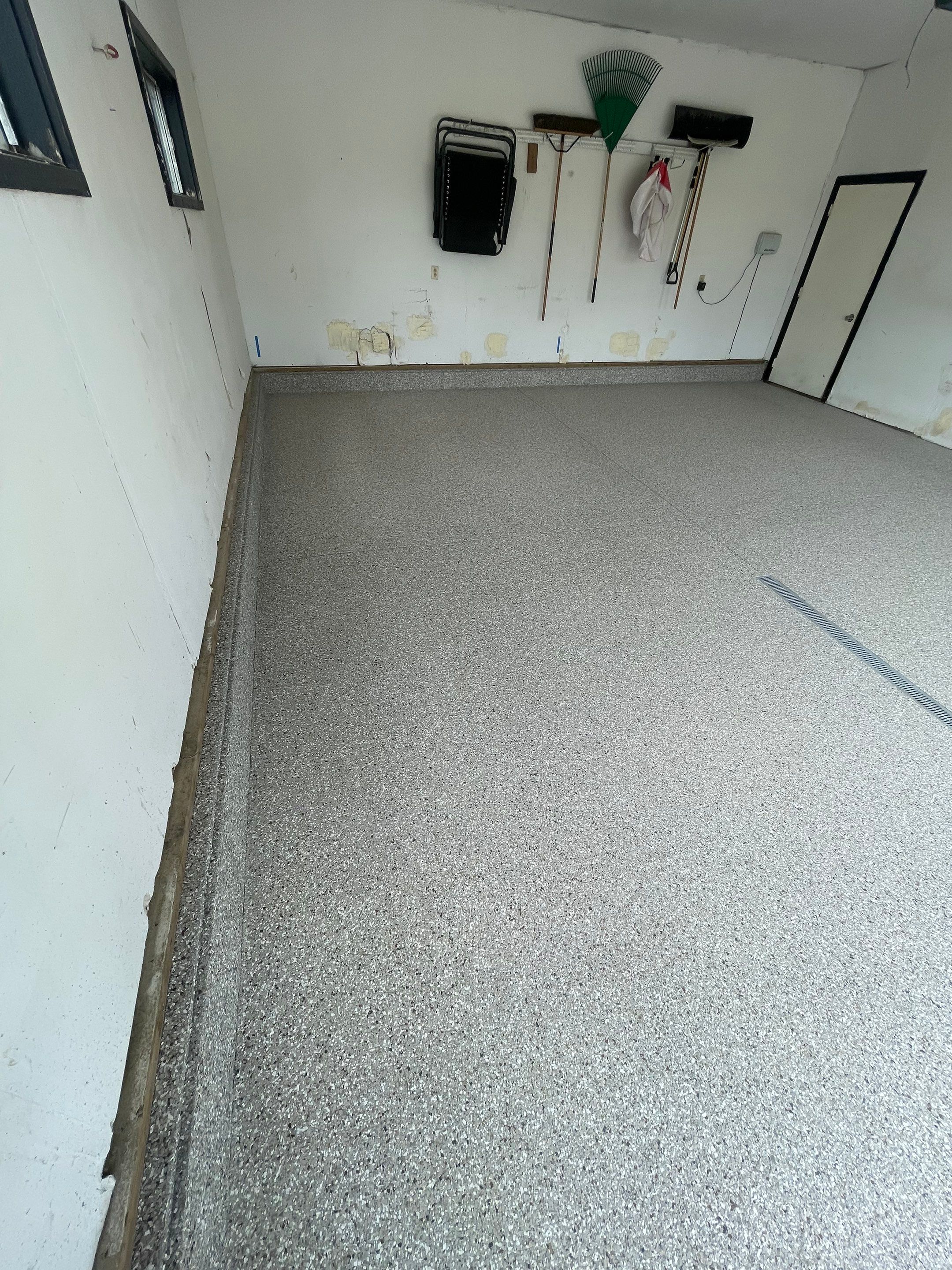 Hartford Residential Garage Floor Transformation With Decorative Chip Coating by Select Painting, Coatings & Garage Cabinets