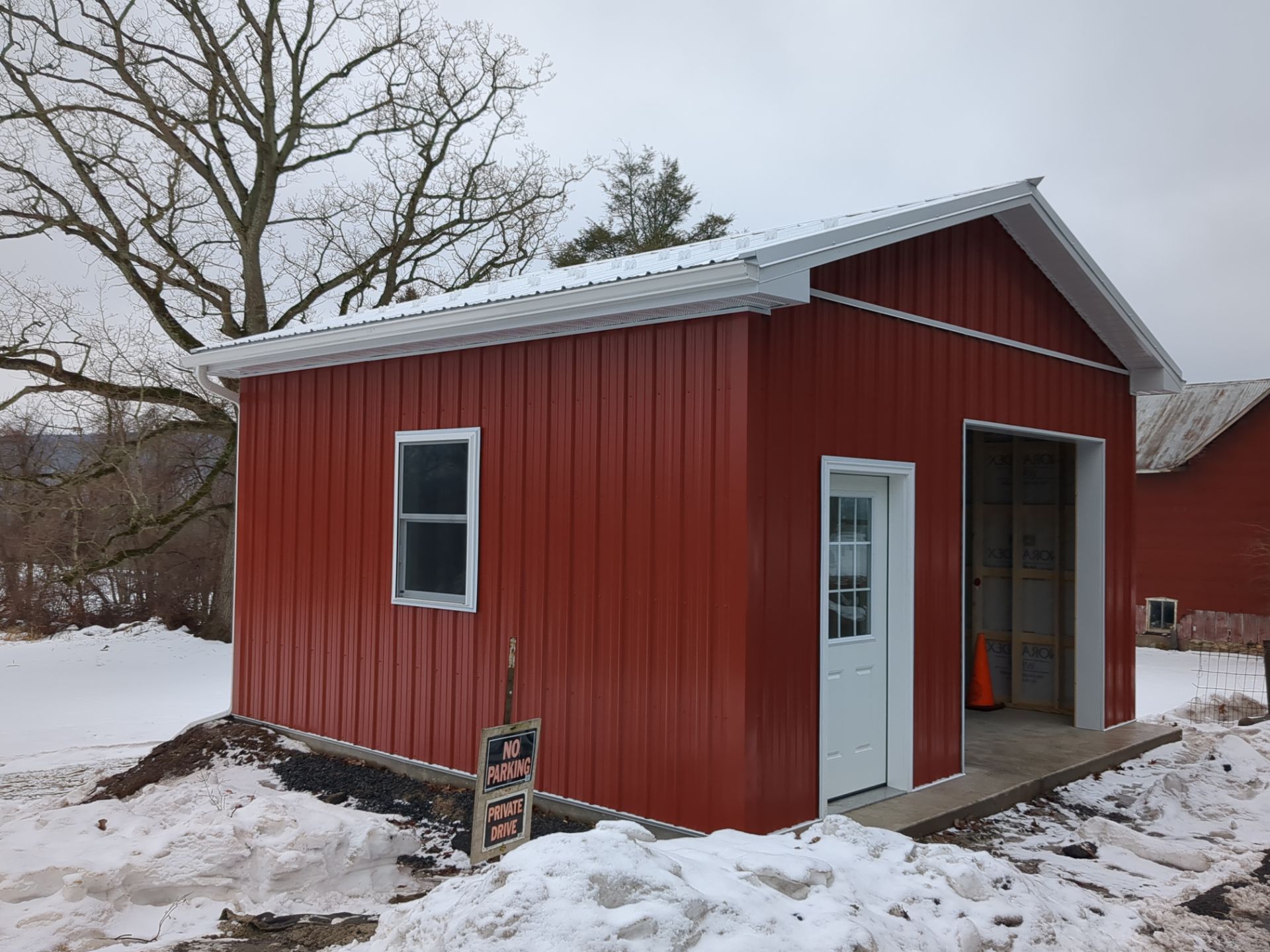 New Red Metal Garage Construction and Residential Window Replacement in Ashland by Esh Builders