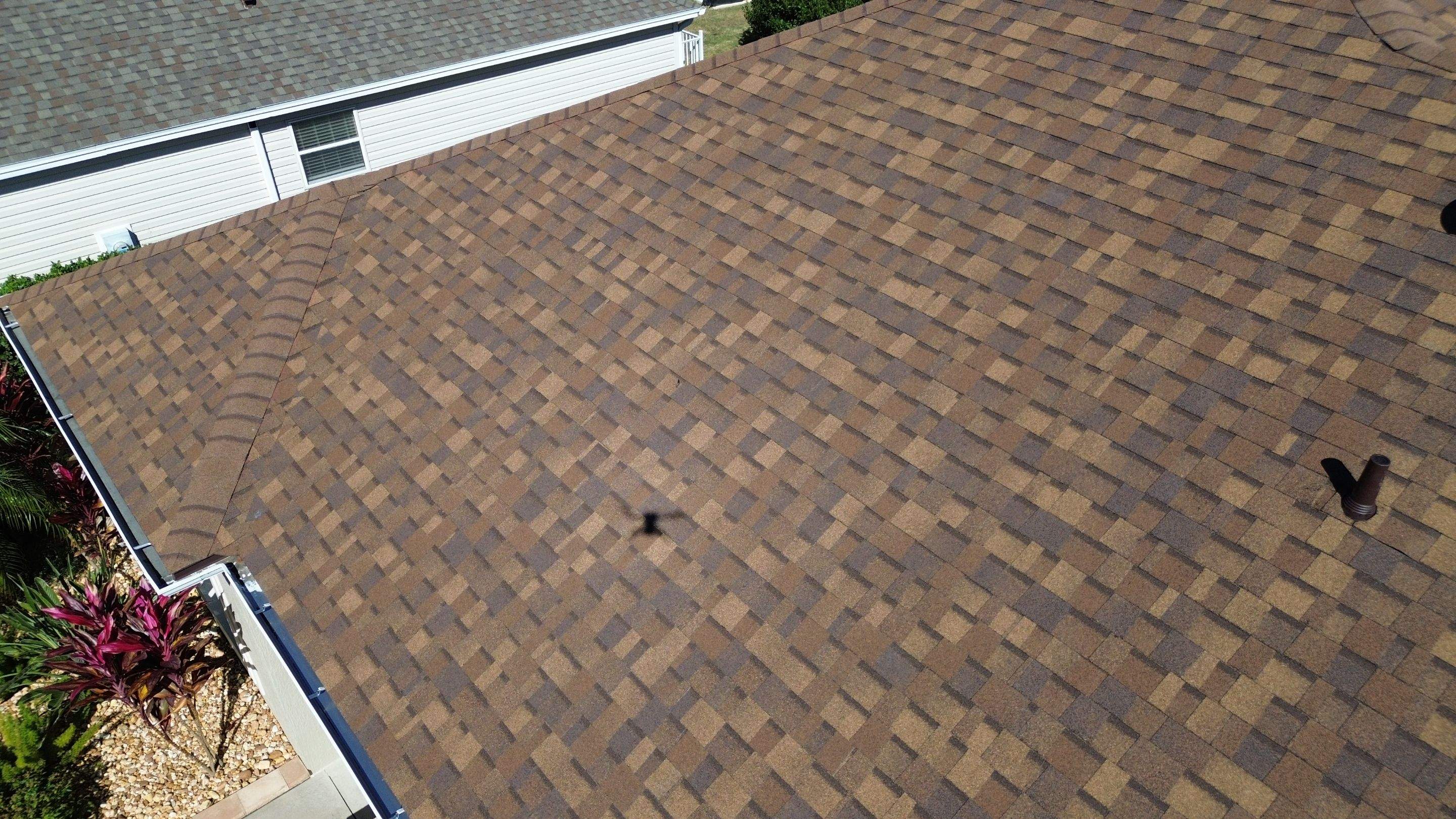 Florida roofers installing shingles by Brehm Roofing