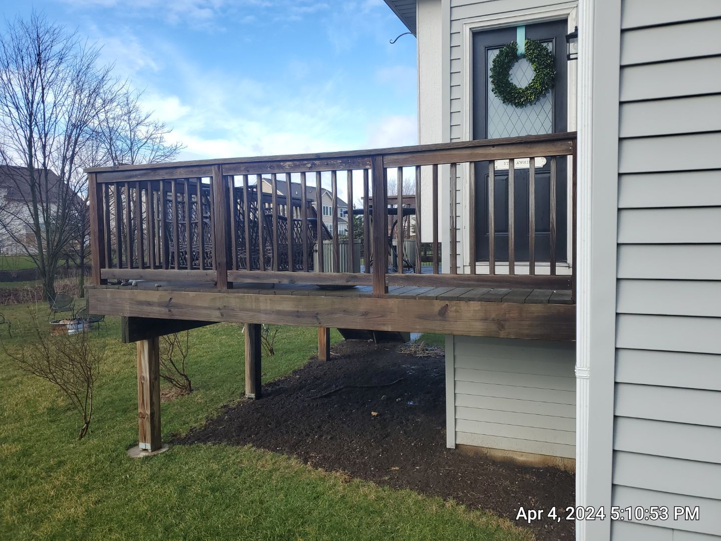 wood deck cleaning and staining by Northern Power Washing LLC.
