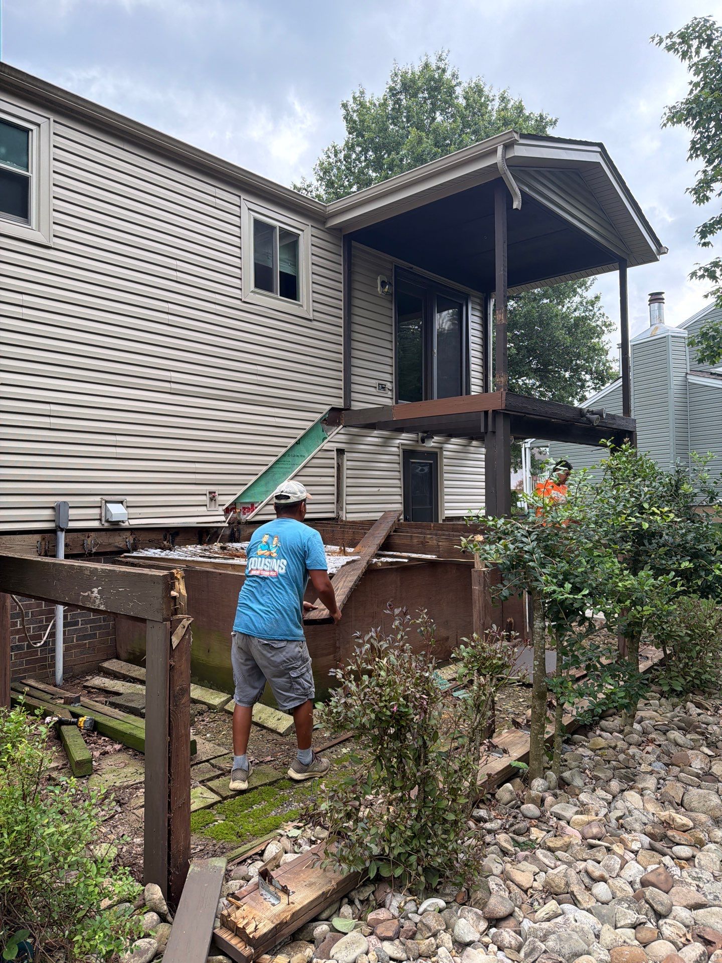 Elevated Composite Deck Installation with Covered Porch in South Park Township by Cousins Roofing Siding & Decks