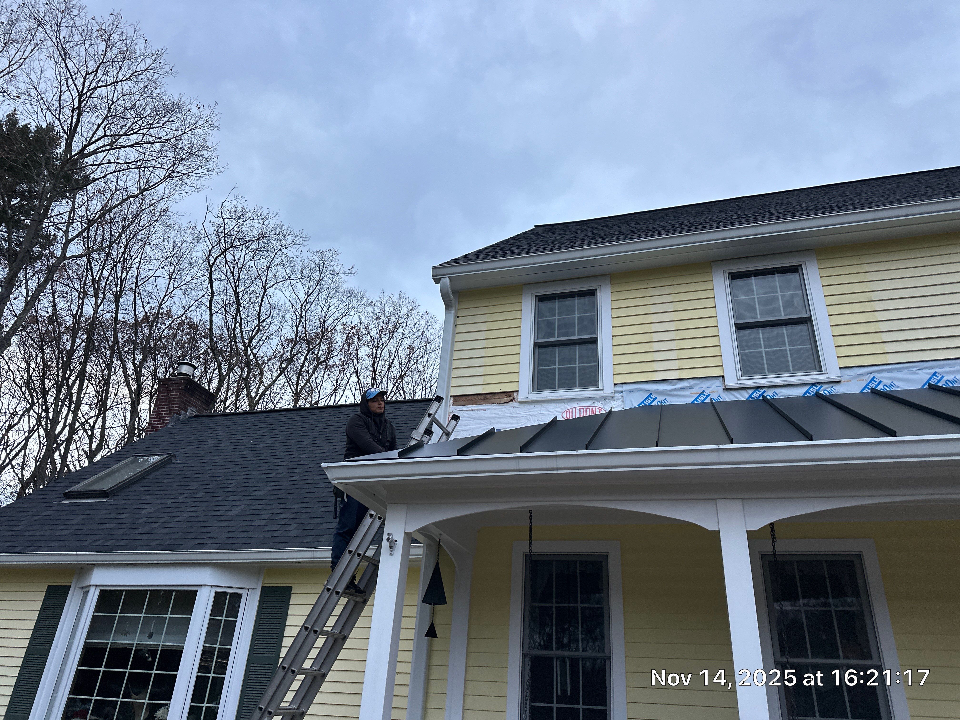 Chelmsford Premium Roof: Onyx Black Shingles with Standing Seam Metal Porch by Mighty Dog Roofing of Greater Middlesex County