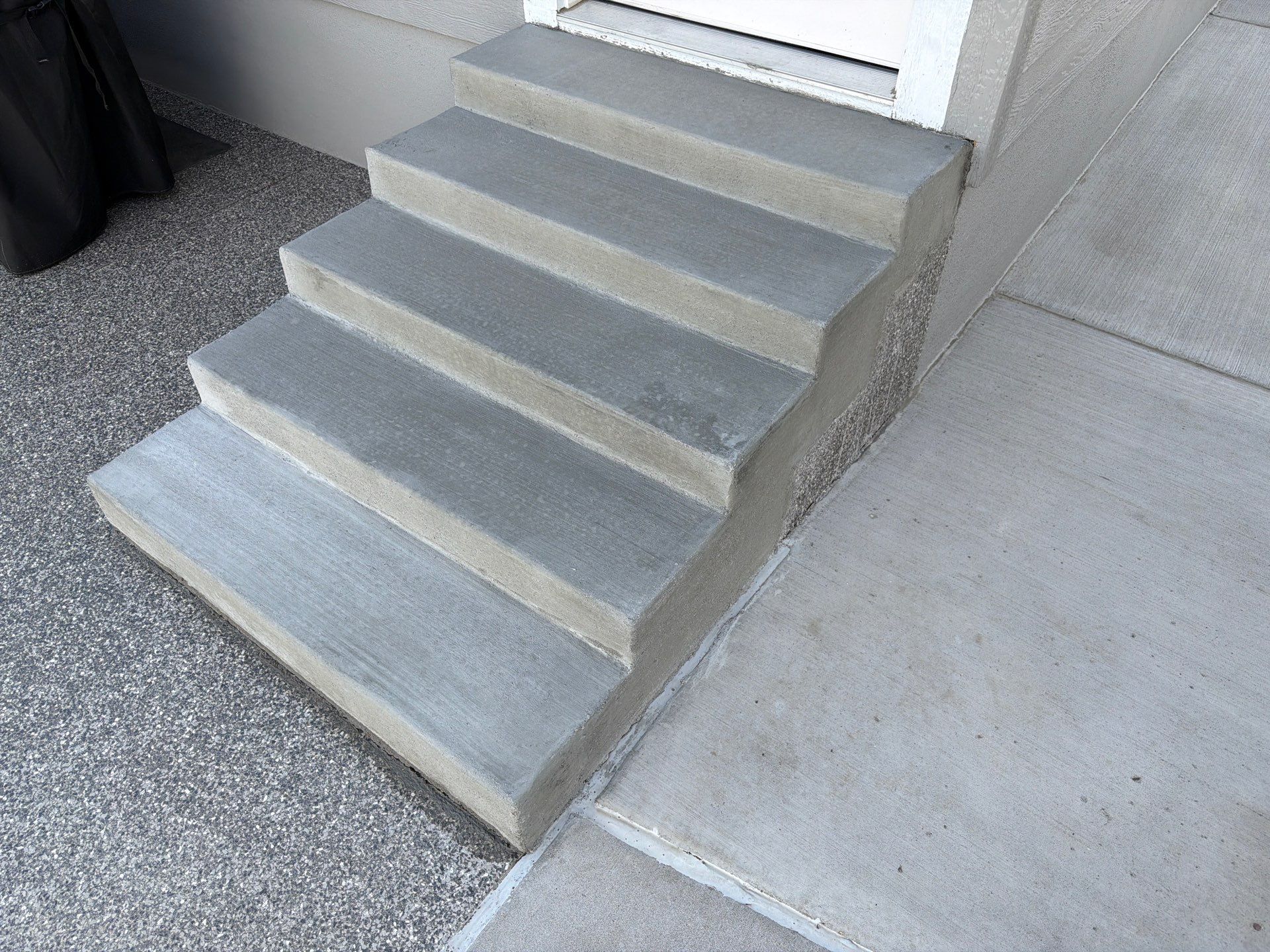 Silver Creek Flak Coating for Patio and Entry Steps in Sioux Falls by Select Painting, Coatings & Garage Cabinets