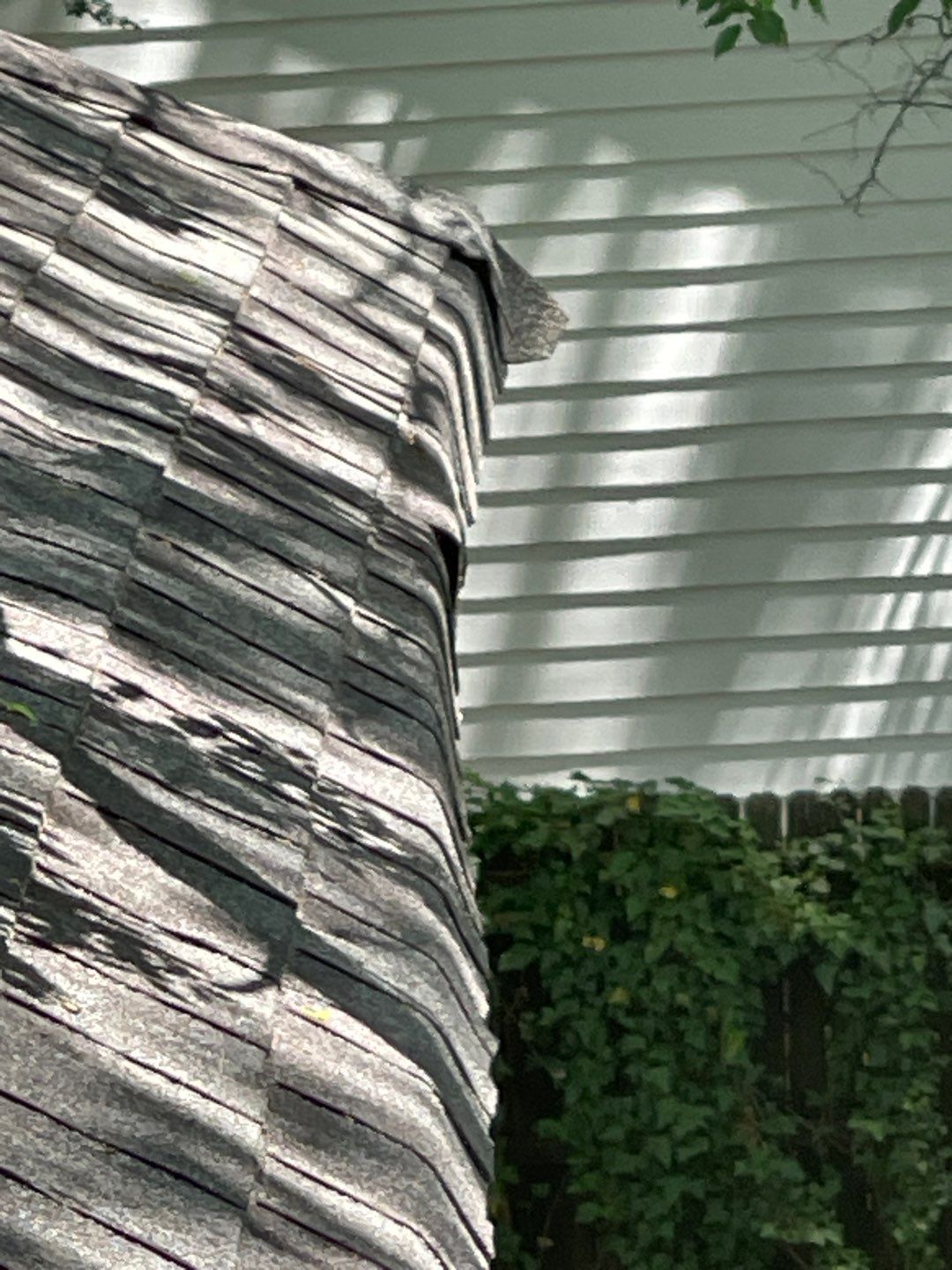 roof replacement and new black gutters by Nailed It Roofing & Remodeling LLC