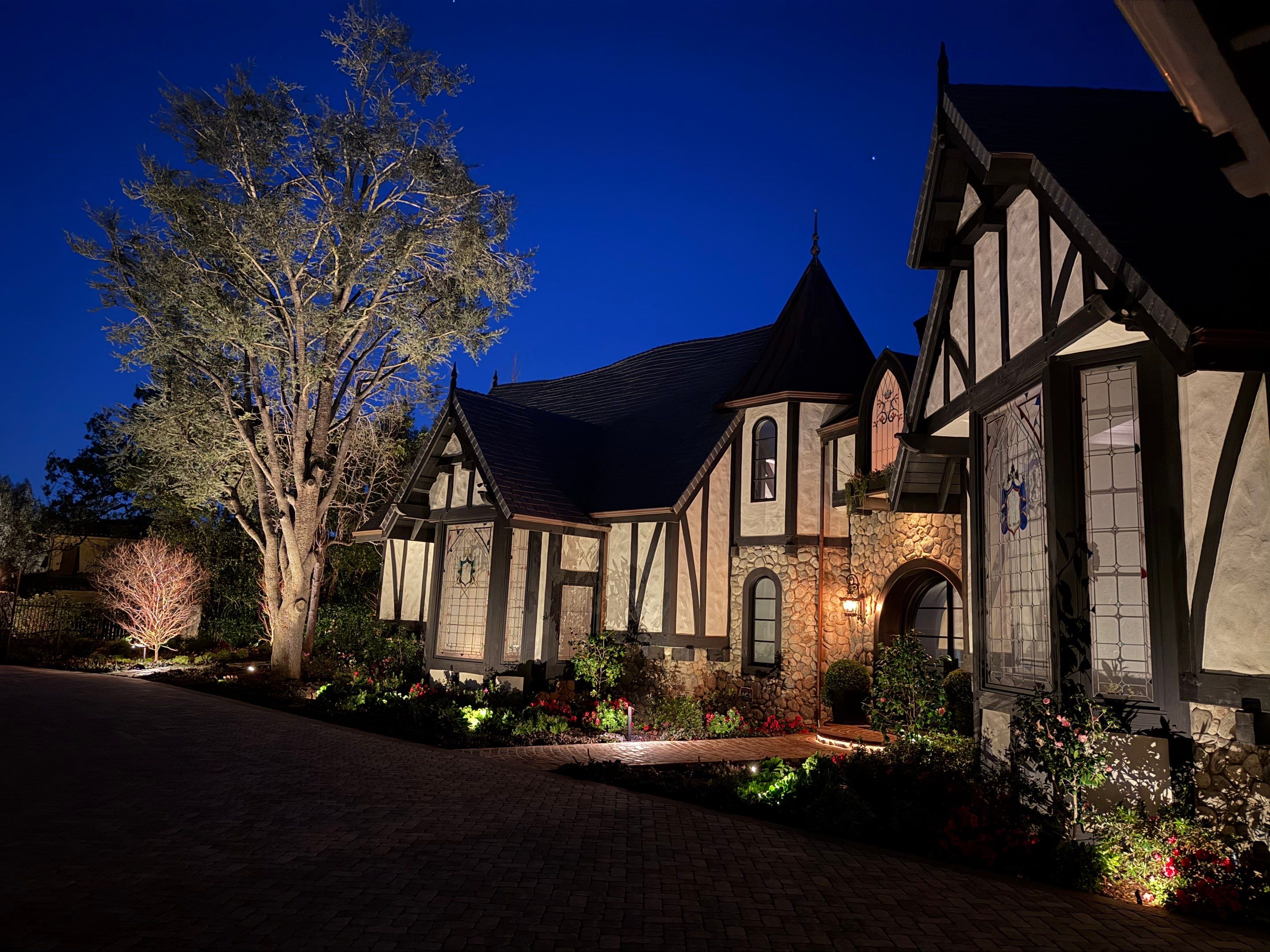 Tudor Estate Landscape Lighting with Integrated Stone Step Illumination by Outdoor Lights + Shades