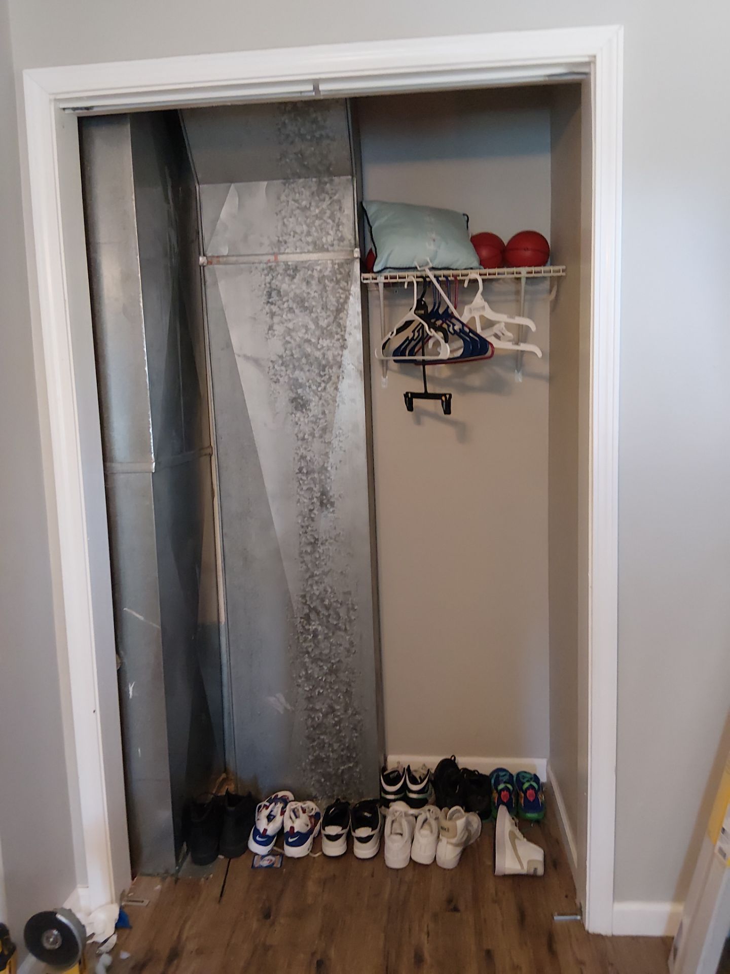 White Paneled Bifold Closet Door Installation by Legendary Services Company LLC.