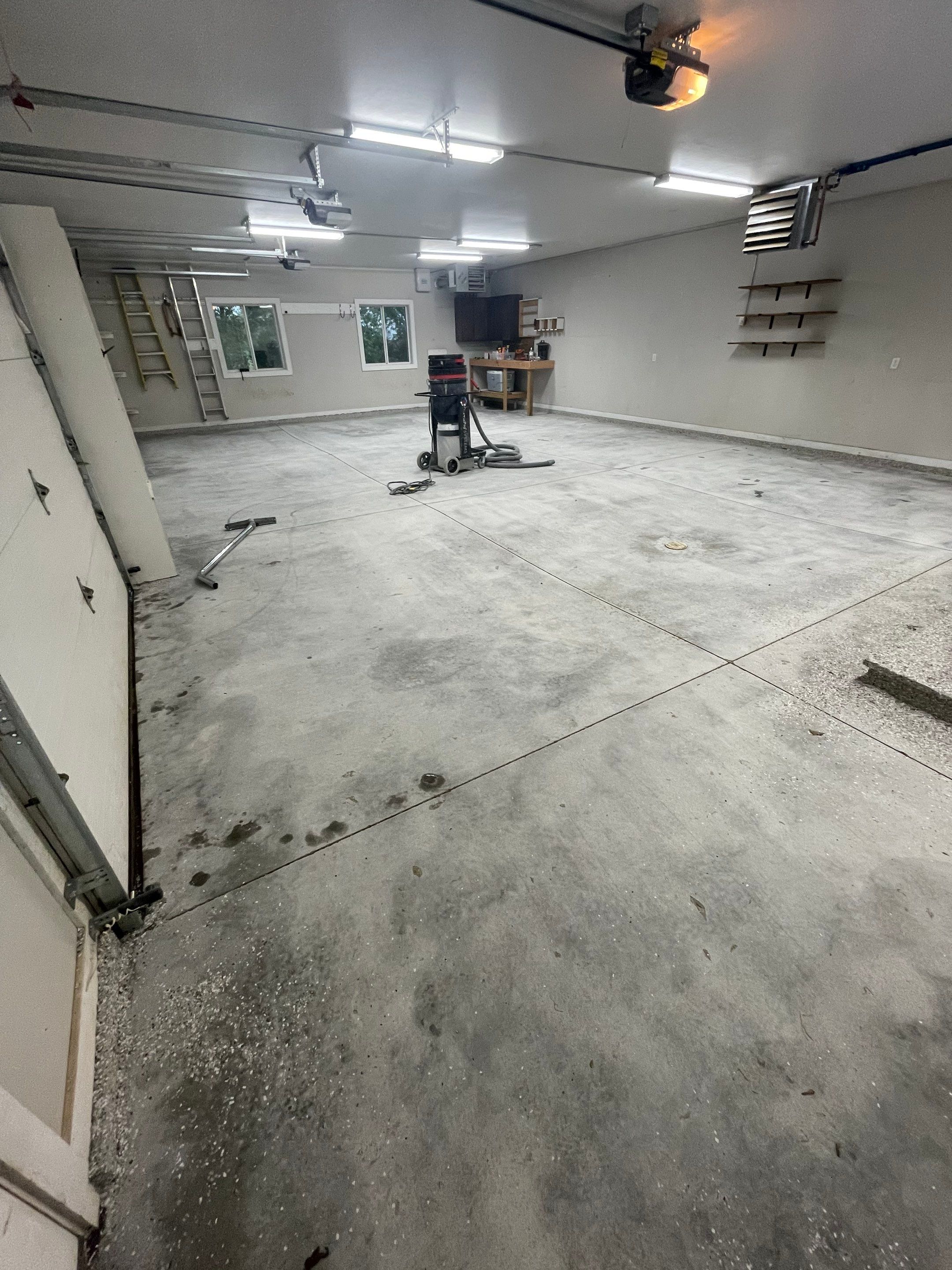 Grey Speckled Polyuera Garage Floor Coating for Hartford Three-Car Garage by Select Painting, Coatings & Garage Cabinets