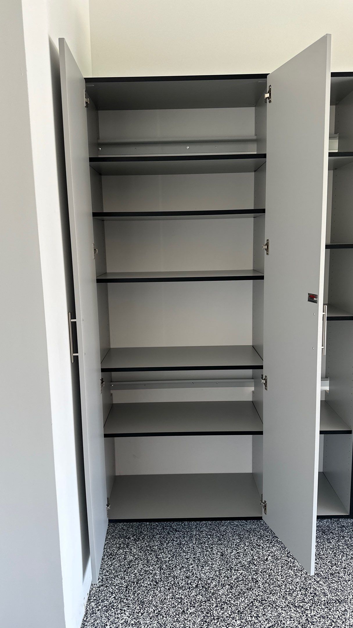 Laura B. garage transformation with a new floor and garage storage by Banner Garage