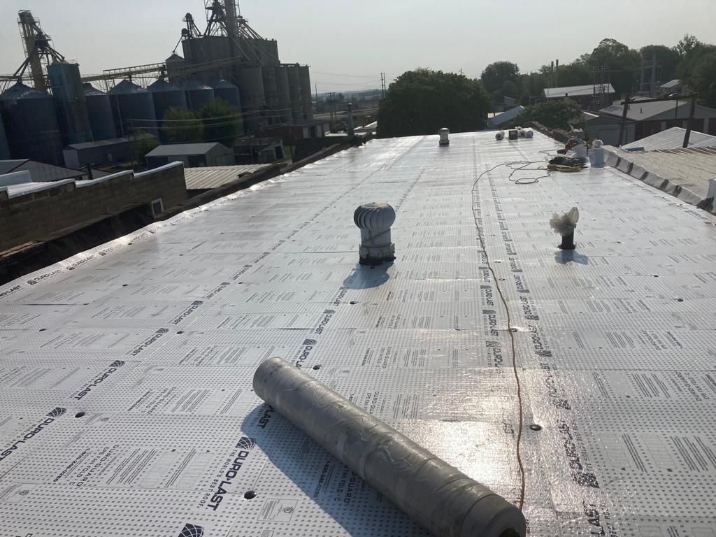 Recover of a downtown building  by Grell Roofing