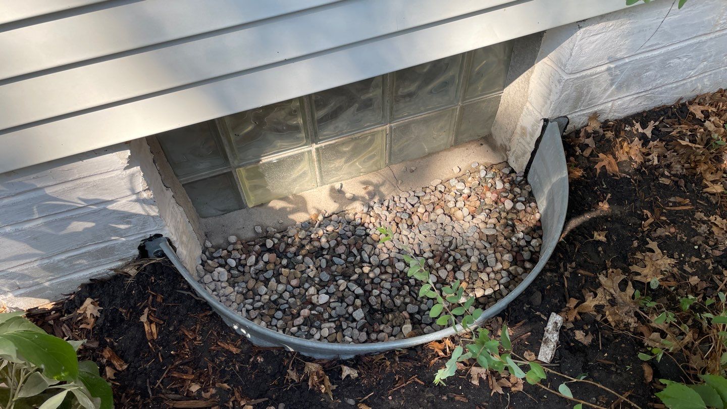Drain Tile, Window Wells & Buried Discharge in Minneapolis by Waterproofing Northeast