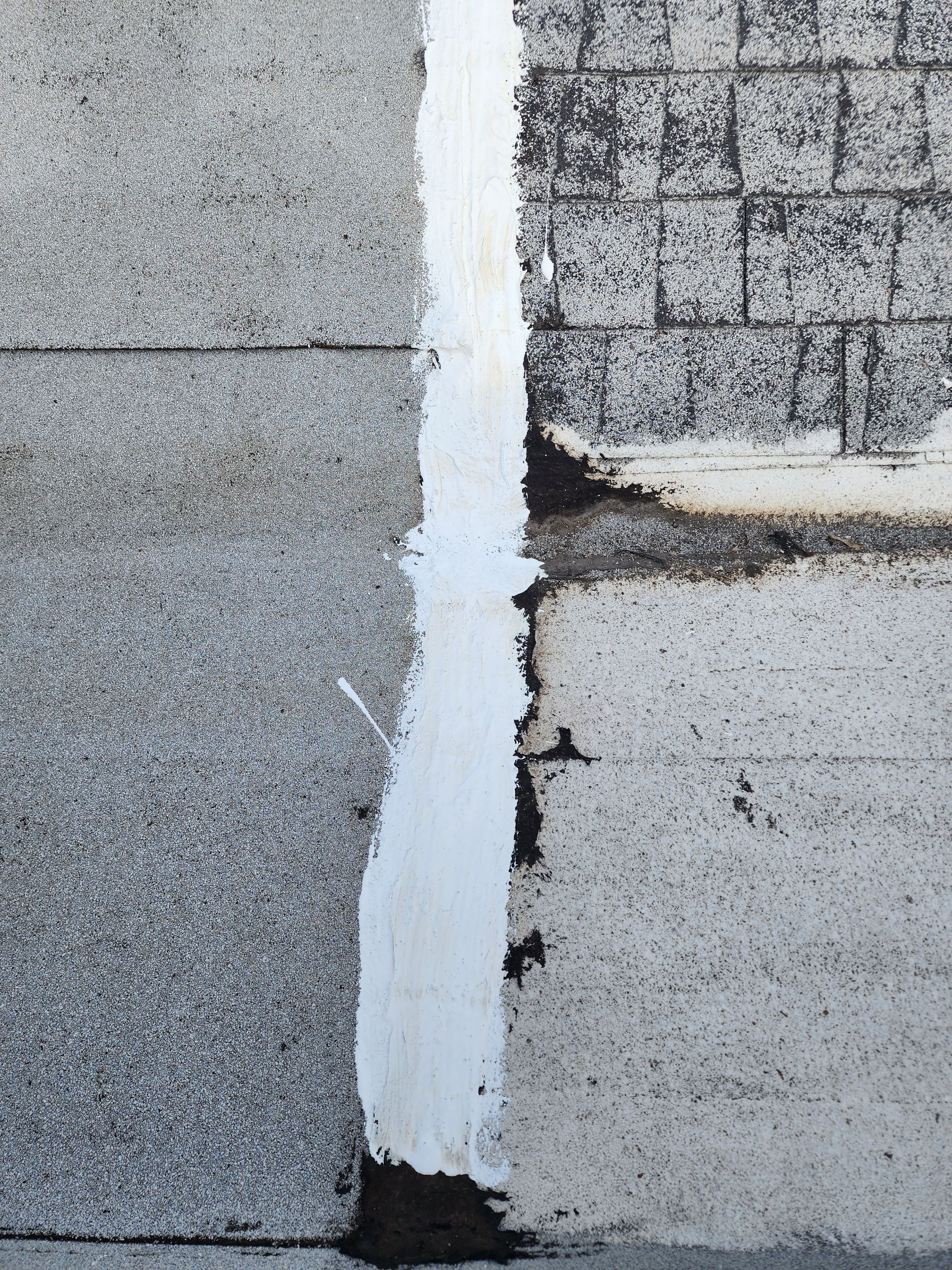 Foam and coatings on commercial roof by Straight Edge Roofing Inc