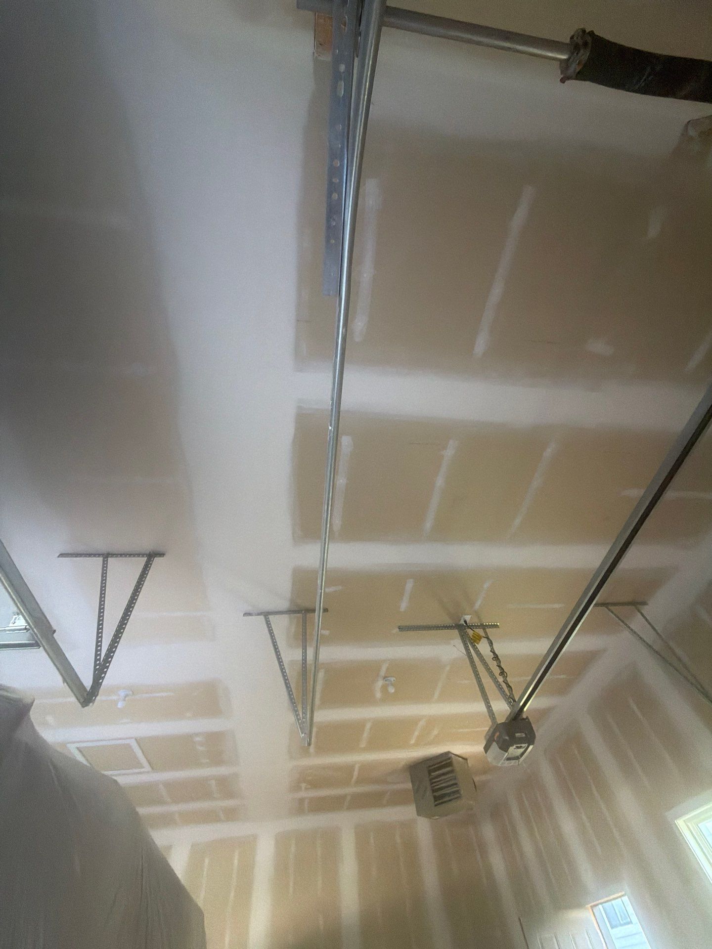 Full Garage Interior Drywall Finishing and Priming in Sioux Falls by Select Painting, Coatings & Garage Cabinets