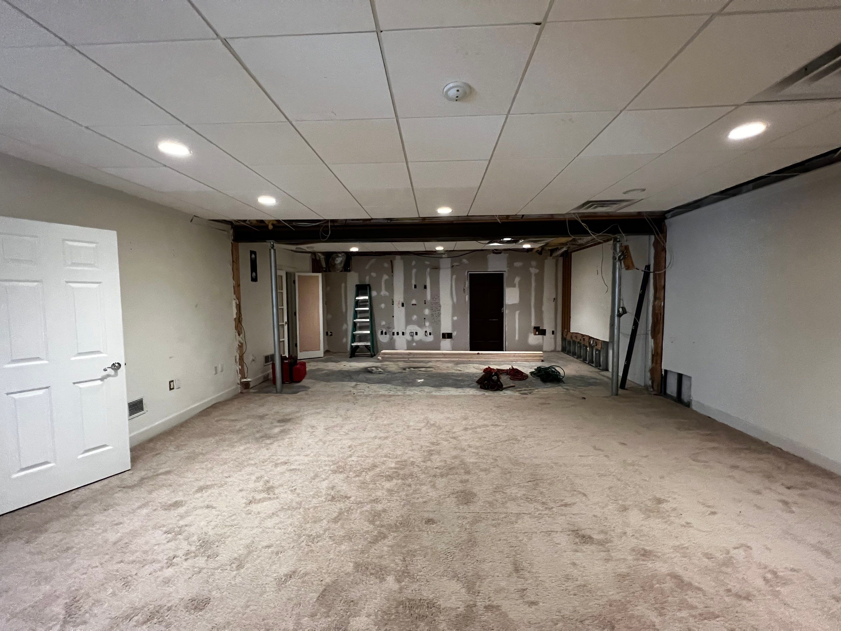 Finished Basement Renovation Featuring Home Theater and Custom Wine Cellar by Swift Home Renovations