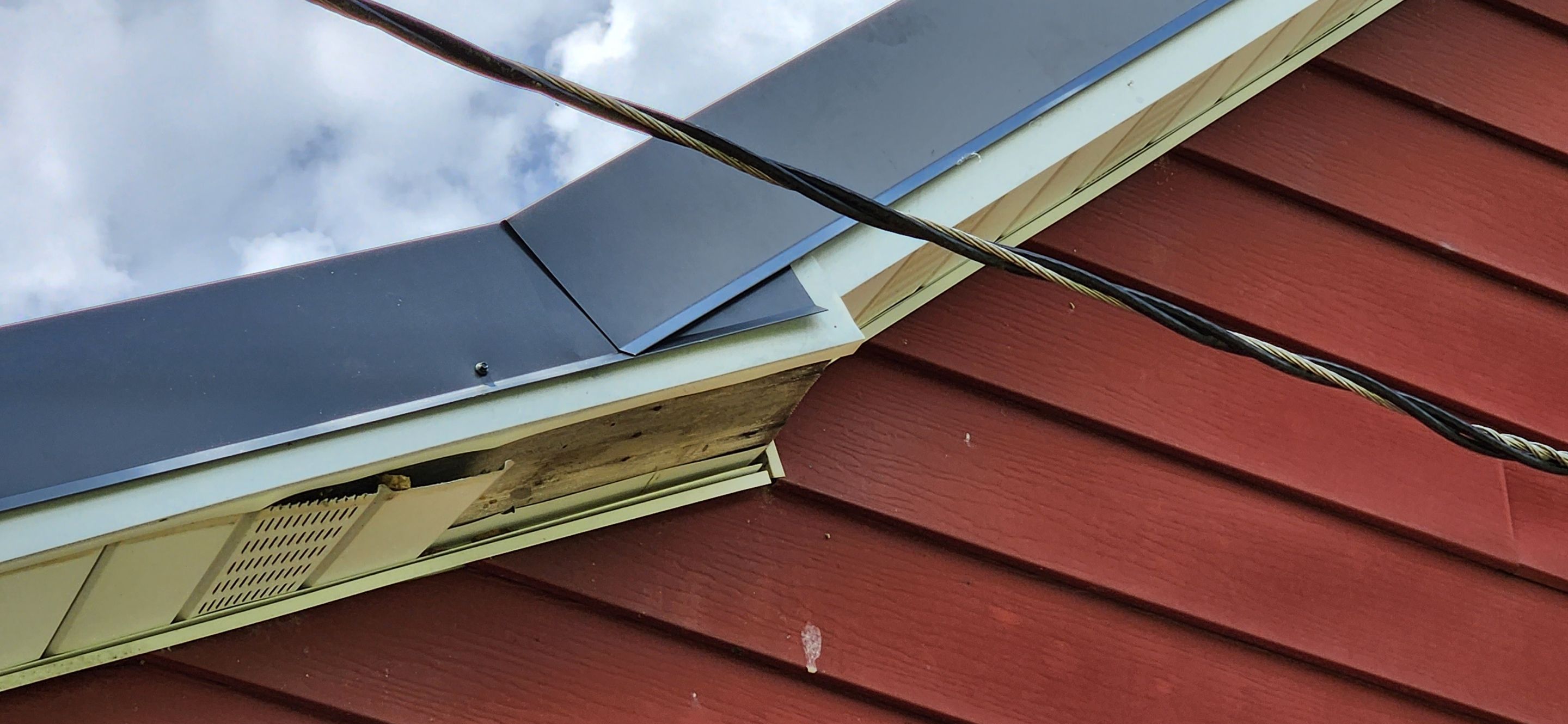 Residential Roofing Installation using 26 Gauge Colored Panels by Hostetler Roofing