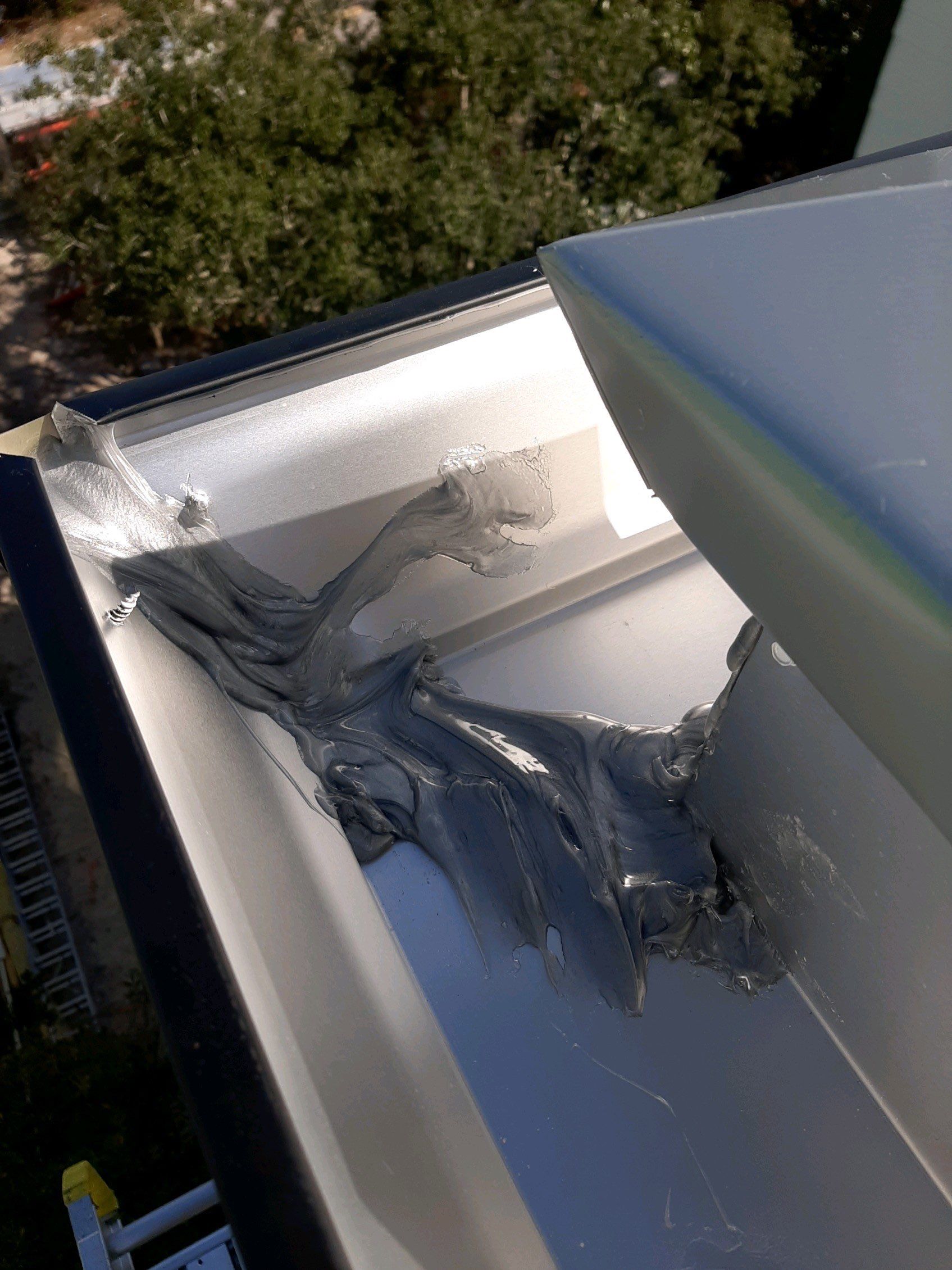 Seamless Gutter Installation Using Black Half Round Seamless Gutters by Gutter Professors