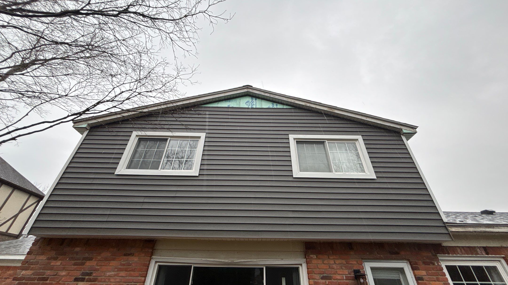 Siding Replacement using Alside Charcoal Smoke and Roof Replacement using Owens Corning Peppercorn by 180 Contractors