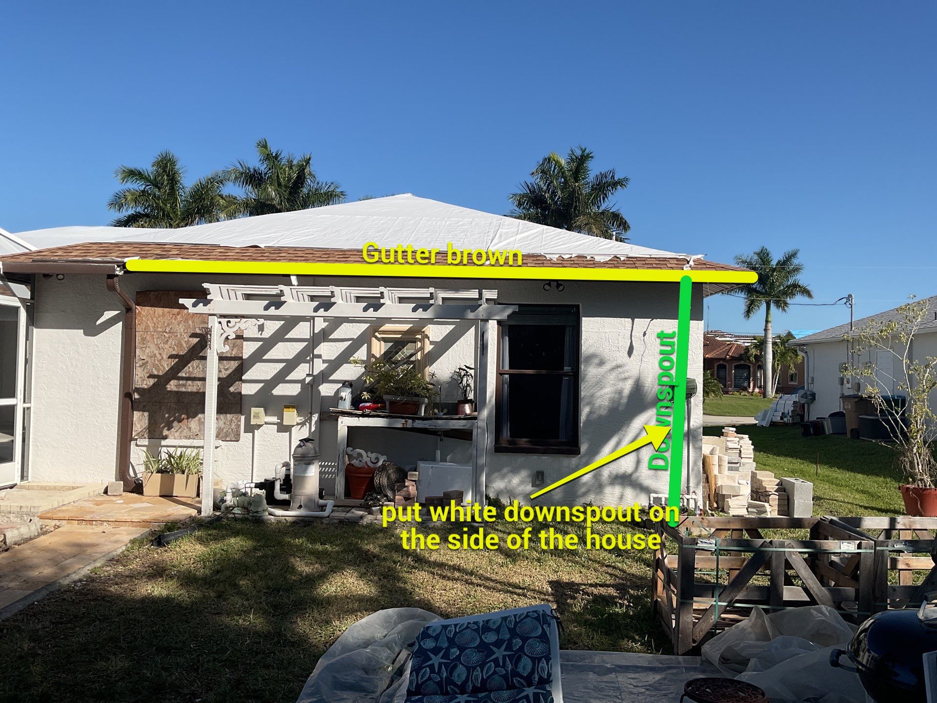 Brown Gutter + White and Brown Downspouts in Cape Coral FL by Gutter Professors