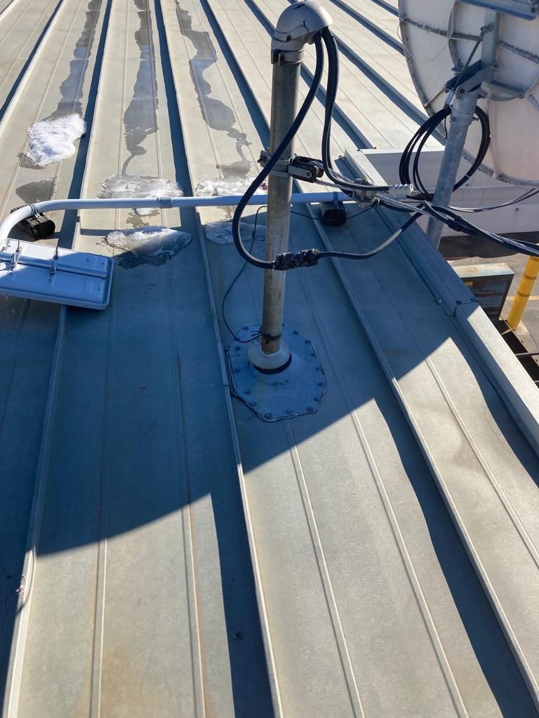 Roof Repair on a metal roof  by Grell Roofing