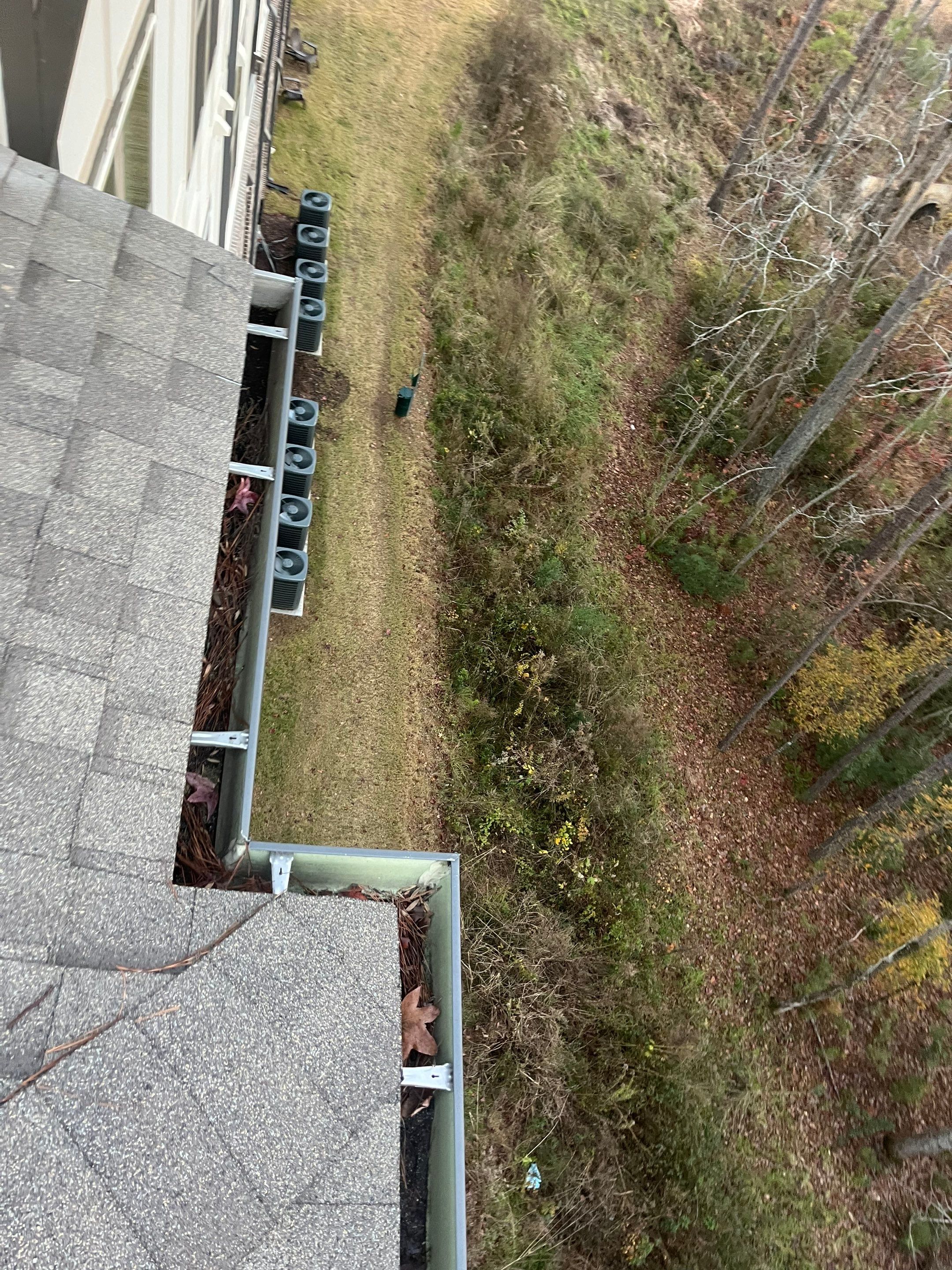 Commercial gutter cleaning Georgia before photo with filled gutters