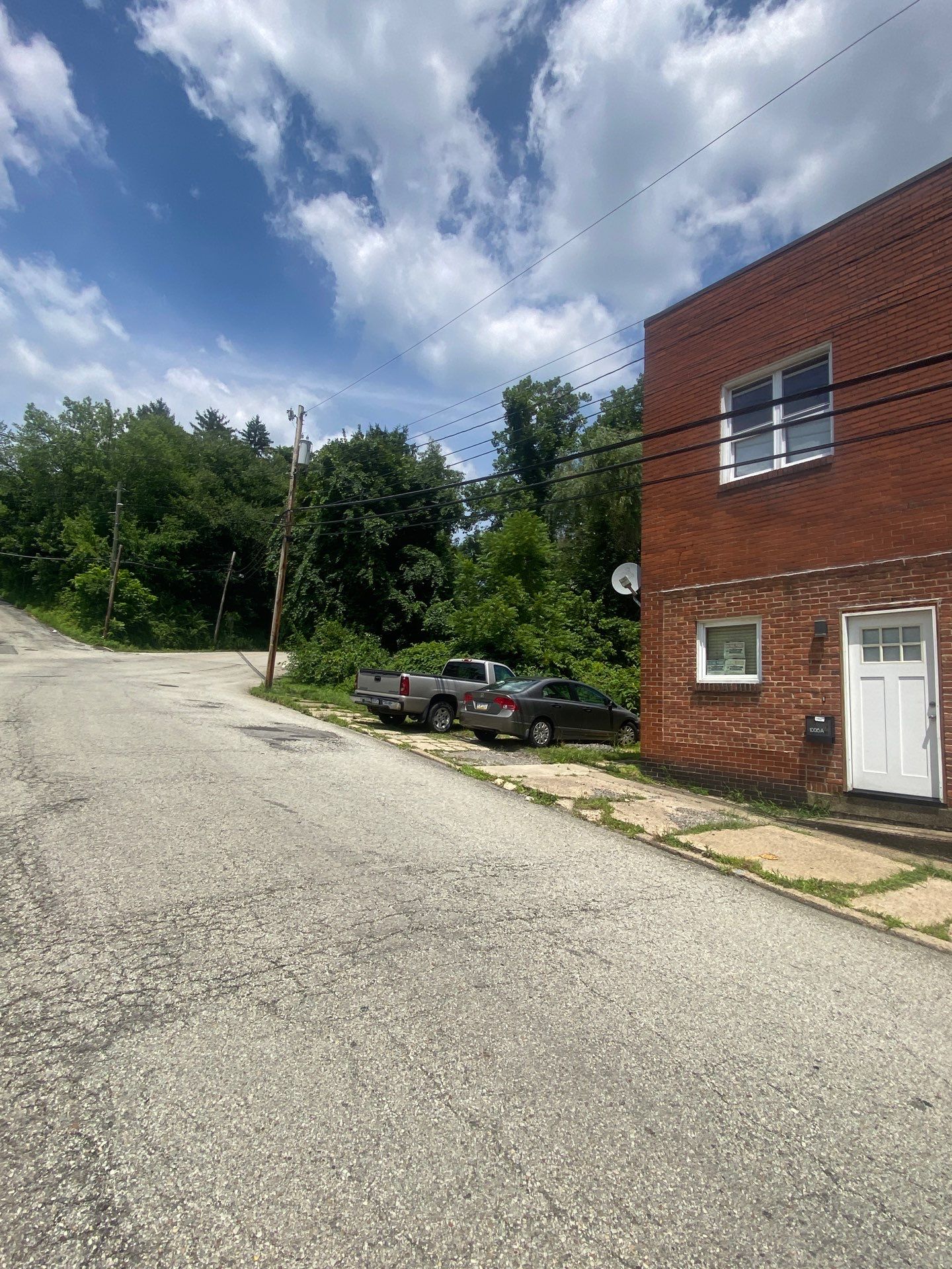White siding  by Cousins Roofing Siding & Decks